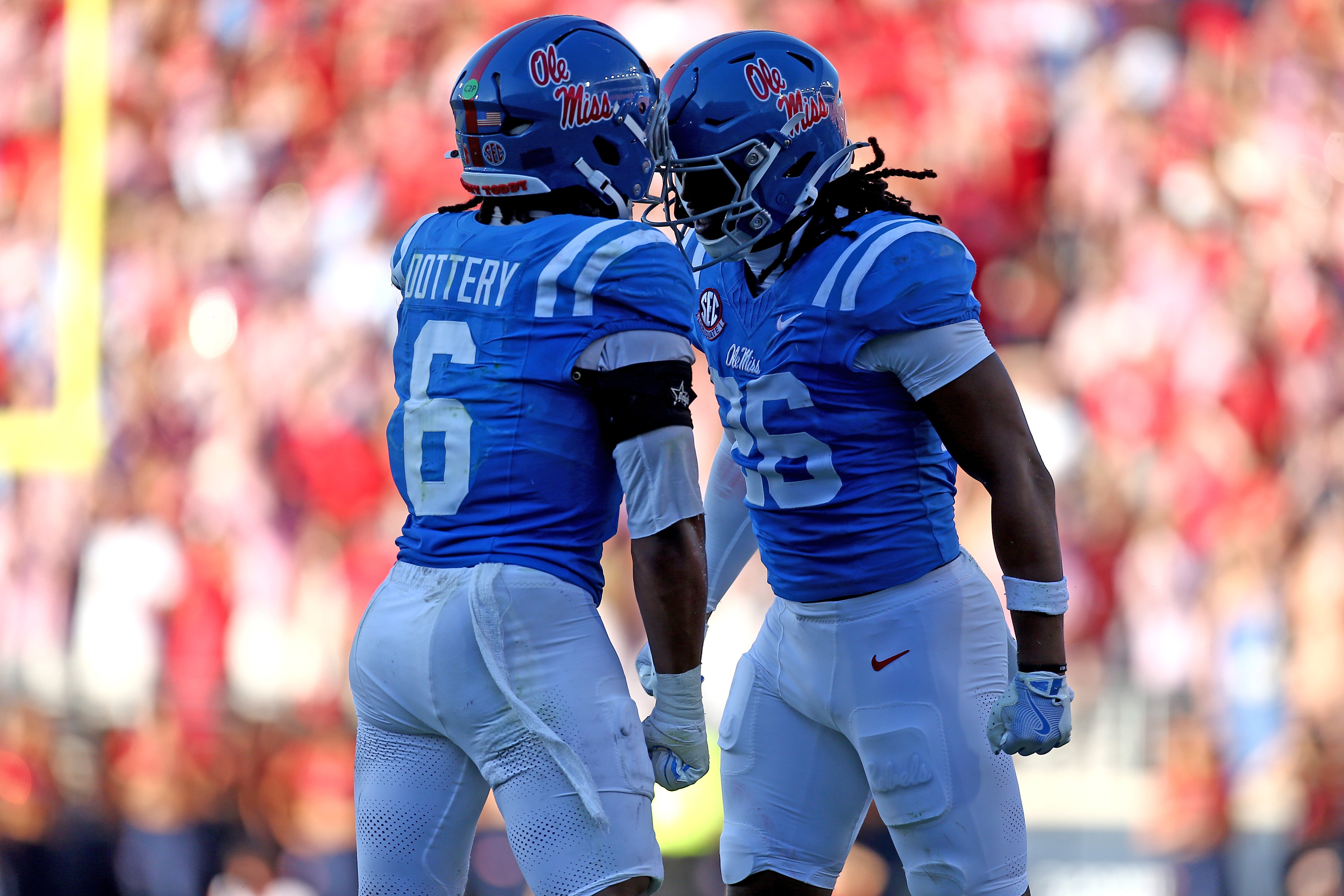 Sep 27, 2025; Oxford, Mississippi, USA; Mississippi Rebels linebacker TJ Dottery (6) and linebacker Tahj Chambers (26) react after a defensive stop during the third quarter against the LSU Tigers at Vaught-Hemingway Stadium.