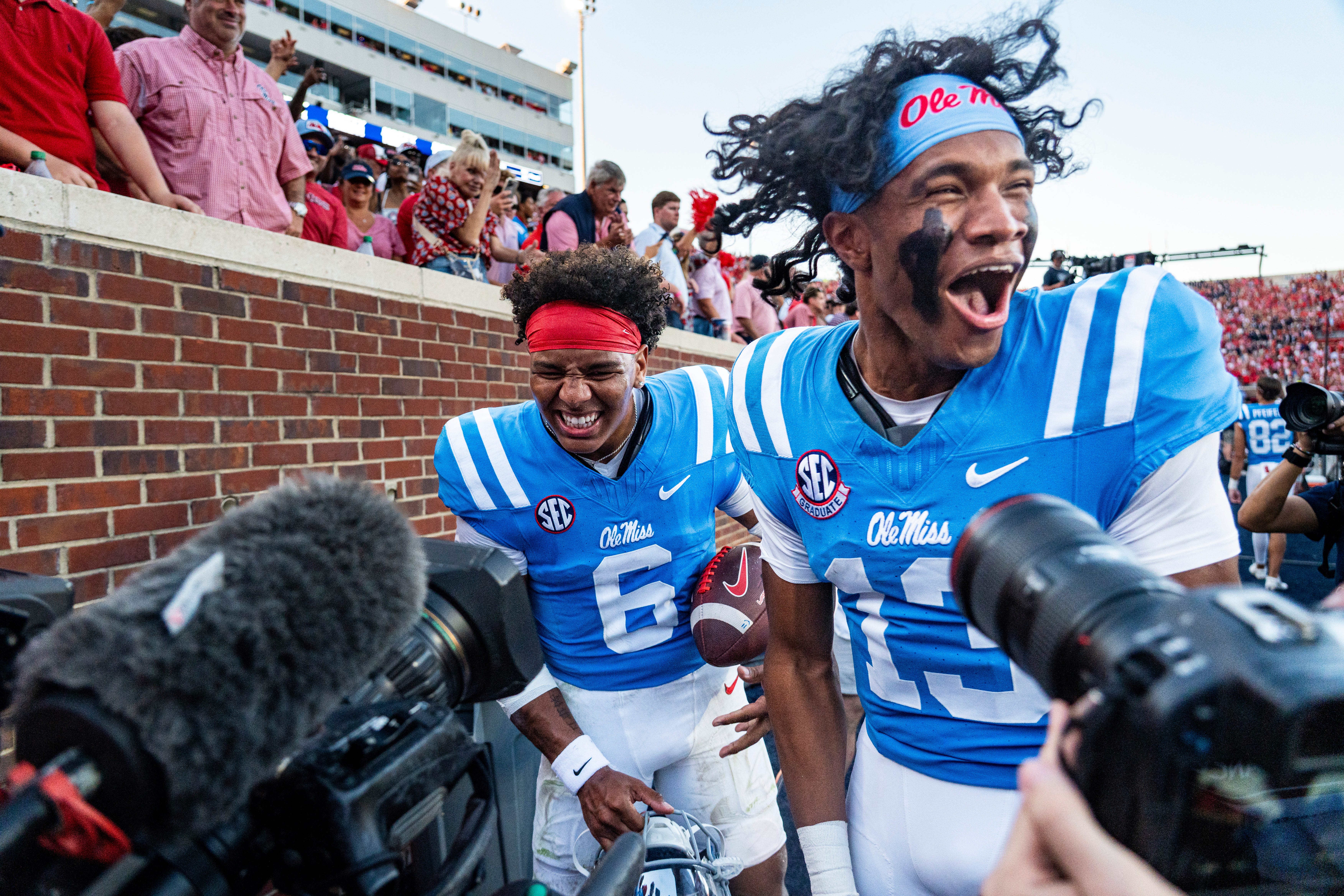 Ole Miss quarterback Trinidad Chambliss (6) and quarterback Austin Simmons (13) celebrate after a college football game between Ole Miss and LSU at Vaught-Hemingway Stadium in Oxford, Miss., on Saturday, Sept. 27, 2025. Ole Miss defeated LSU 24-19.