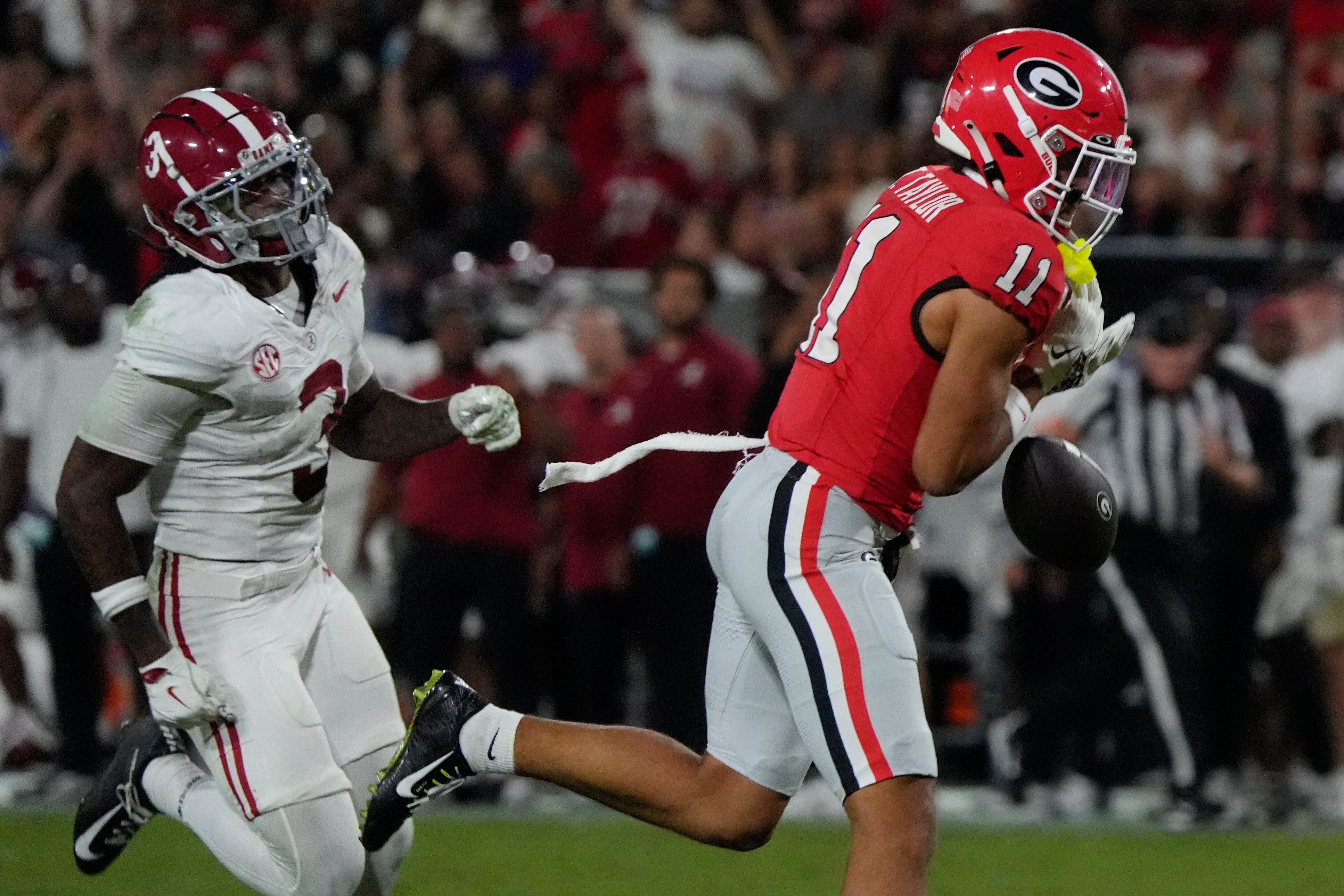 Georgia Bulldogs wide receiver Talyn Taylor (11) drops a pass from Georgia Bulldogs quarterback Gunner Stockton (14) during the second half of a NCAA college football game against Alabama in Athens, Ga., on Saturday, September 27, 2025.
