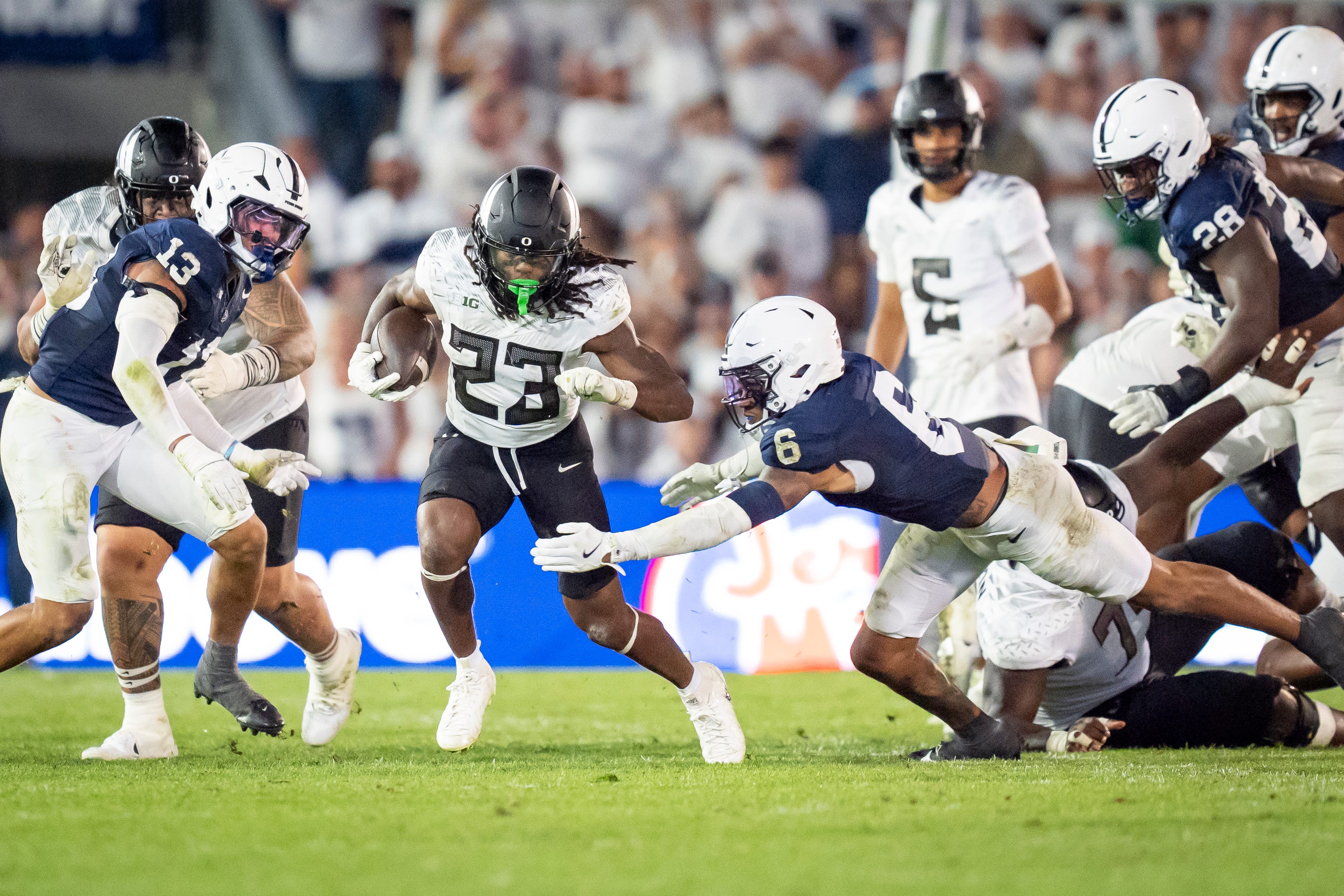 Oregon running back Dierre Hill Jr. picks up yards for the Ducks as the Oregon Ducks face the Penn State Nittany Lions on Sept. 27, 2025, at Beaver Stadium in University Park, Pennsylvania.