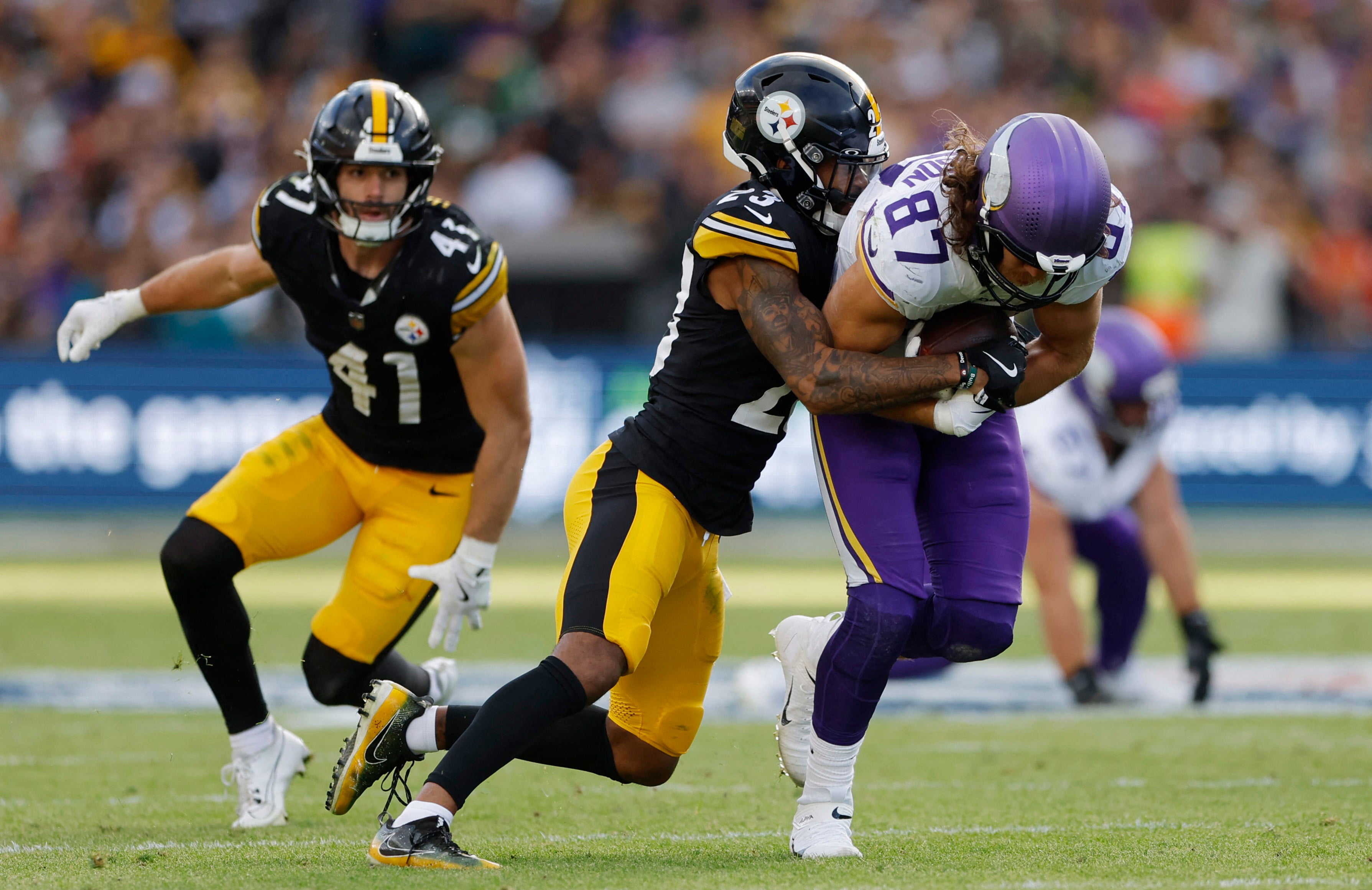 [US, Mexico, & Canada customers only] Sep 28, 2025; Dublin, IRELAND; Minnesota Vikings tight end T.J. Hockenson in action with Pittsburgh Steelers player Darius Slay in a NFL International Series game at Croke Park.