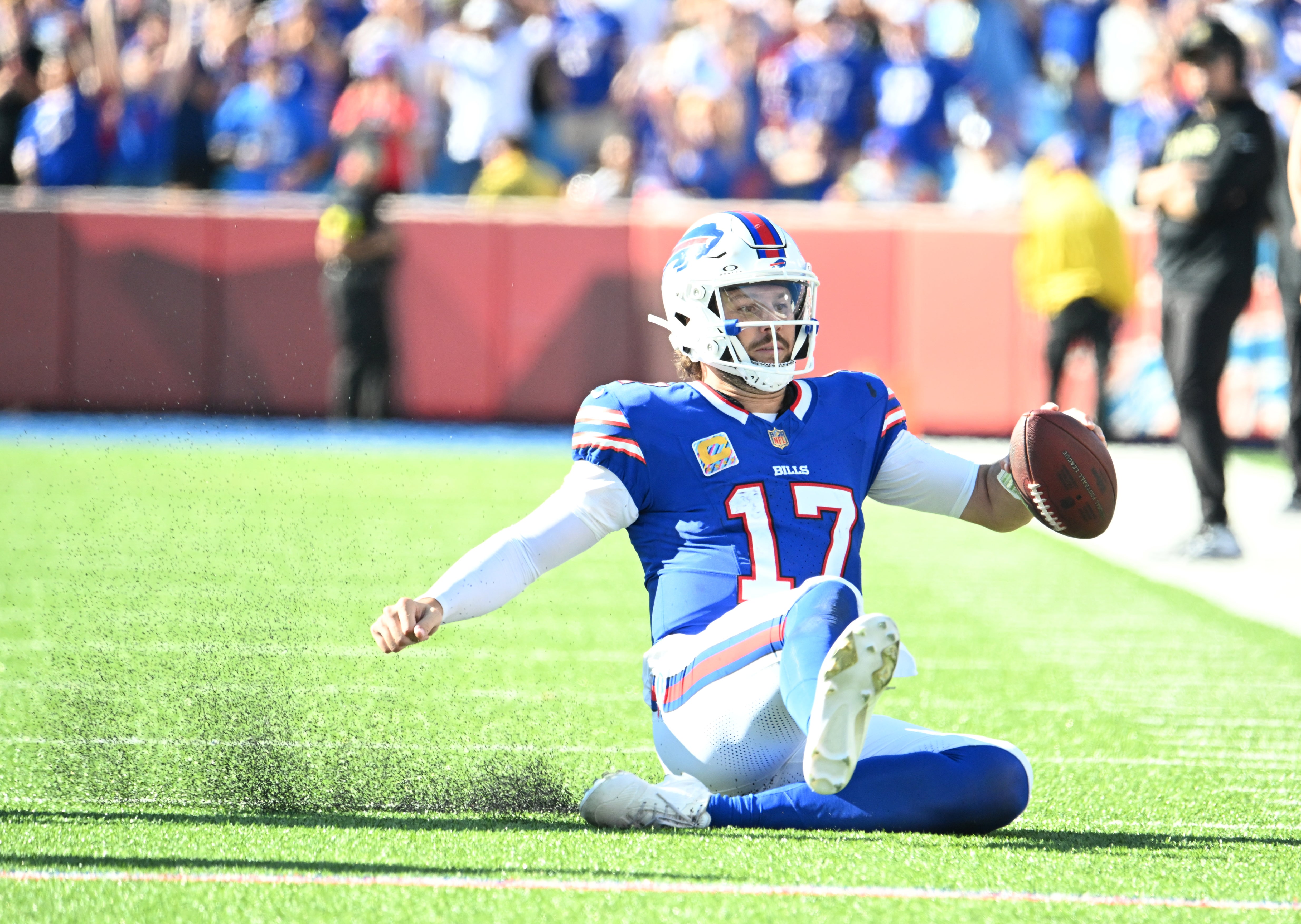 Sep 28, 2025; Orchard Park, New York, USA; Buffalo Bills quarterback Josh Allen (17) slides after running for a gain during the fourth quarter against the New Orleans Saints at Highmark Stadium.