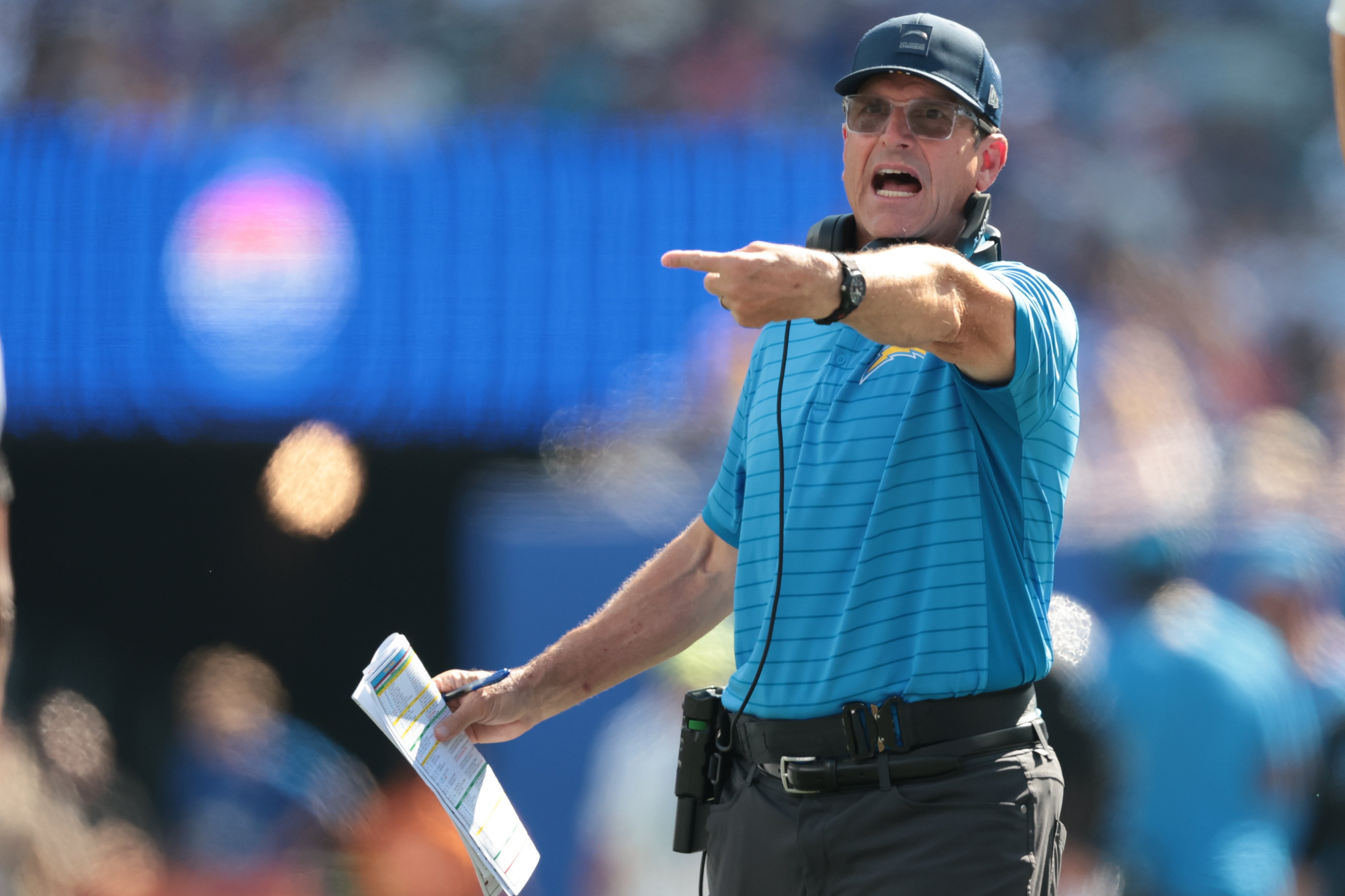 Sep 28, 2025; East Rutherford, New Jersey, USA; Los Angeles Chargers head coach Jim Harbaugh reacts during the first half against the New York Giants at MetLife Stadium. Mandatory Credit: Vincent Carchietta-Imagn Images
