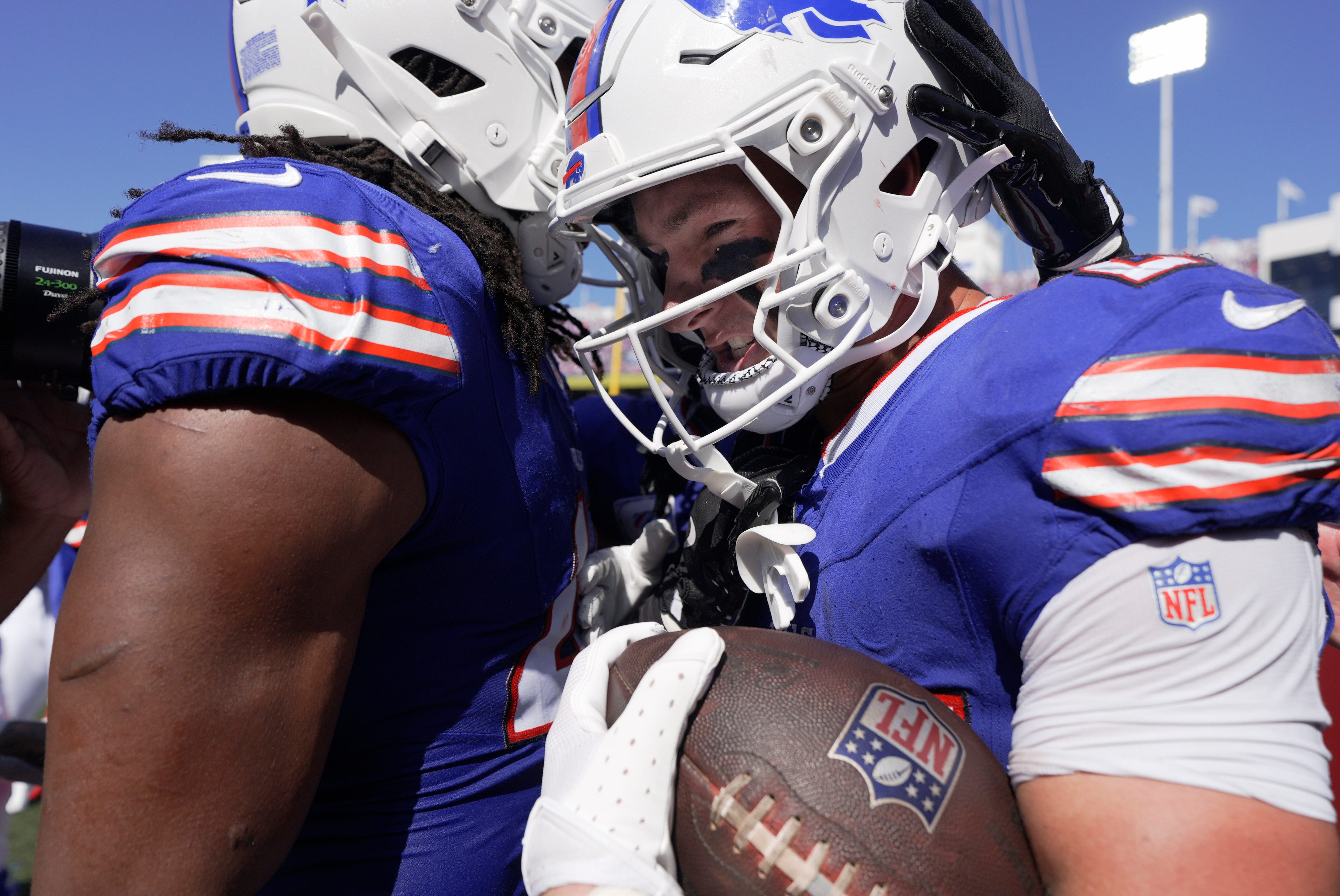 Buffalo Bills safety Cole Bishop is hugged by teammates for his interception during first half action of the Bills home game against the New Orleans Saints in Orchard Park on Sept. 28, 2025.