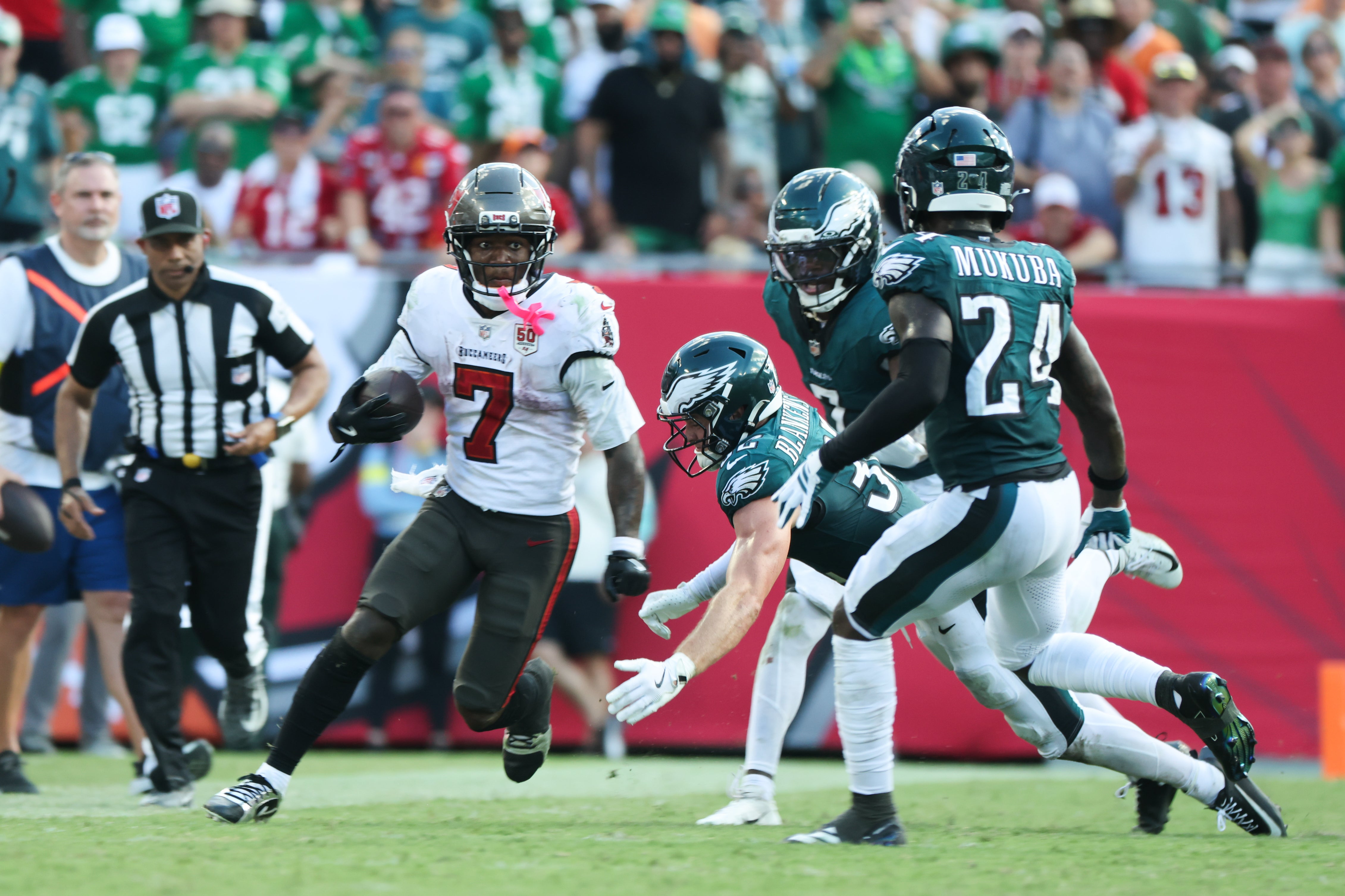 Sep 28, 2025; Tampa, Florida, USA; Tampa Bay Buccaneers running back Bucky Irving (7) runs the ball during the second half against the Philadelphia Eagles at Raymond James Stadium.