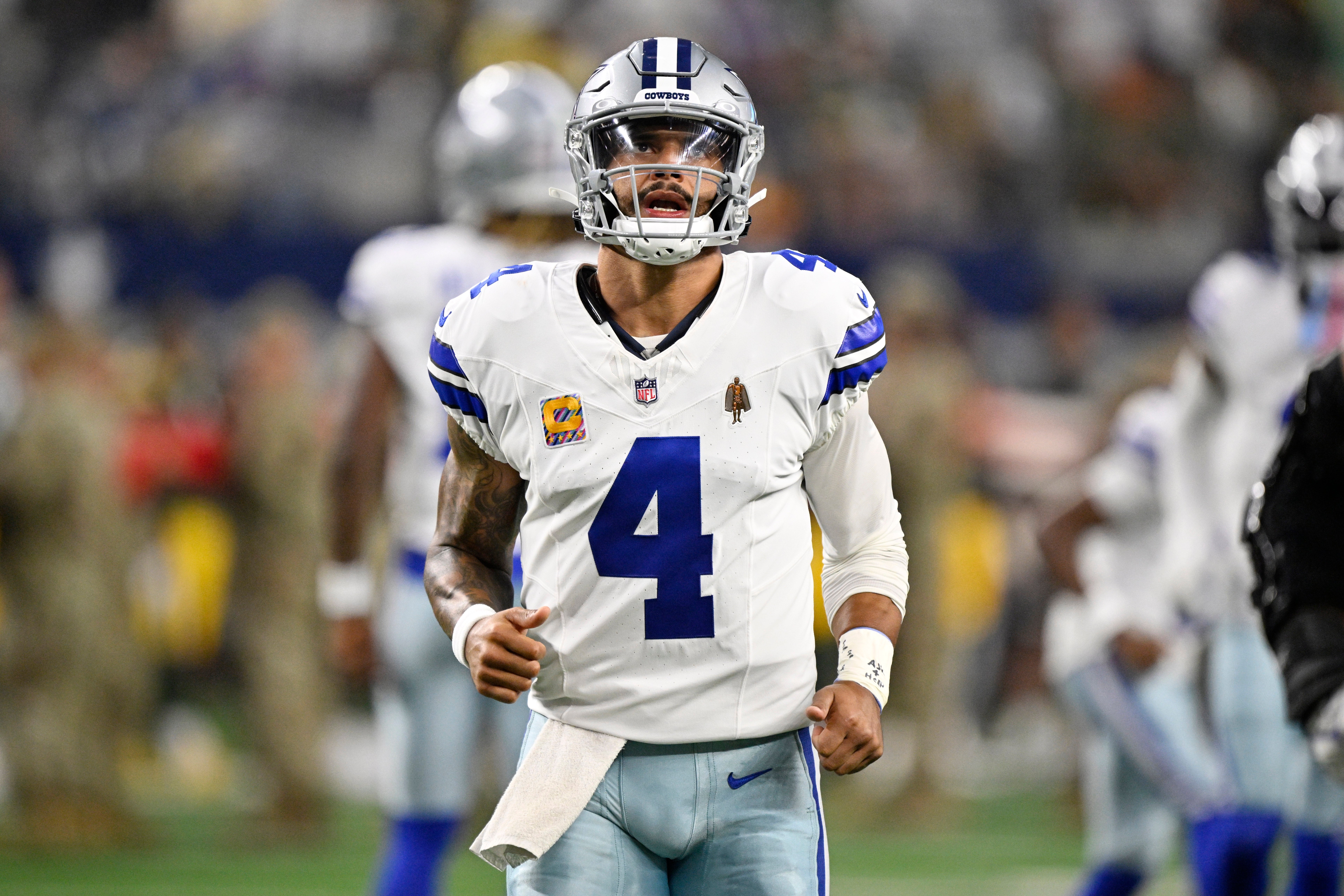 Dallas Cowboys quarterback Dak Prescott (4) looks on before the game against the Green Bay Packers at AT&T Stadium.