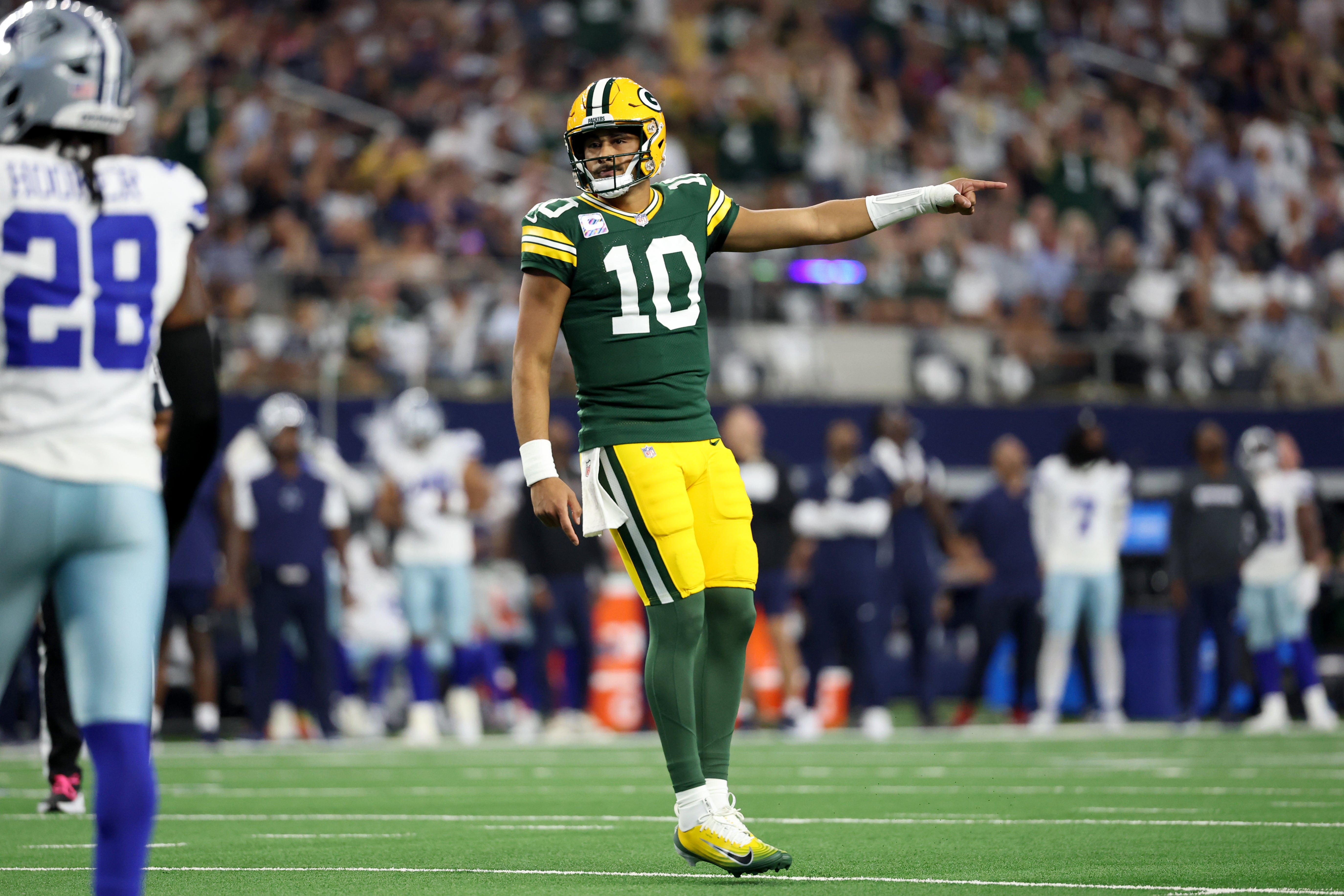 Sep 28, 2025; Arlington, Texas, USA; Green Bay Packers quarterback Jordan Love (10) reacts in the first quarter against the Dallas Cowboys at AT&T Stadium.