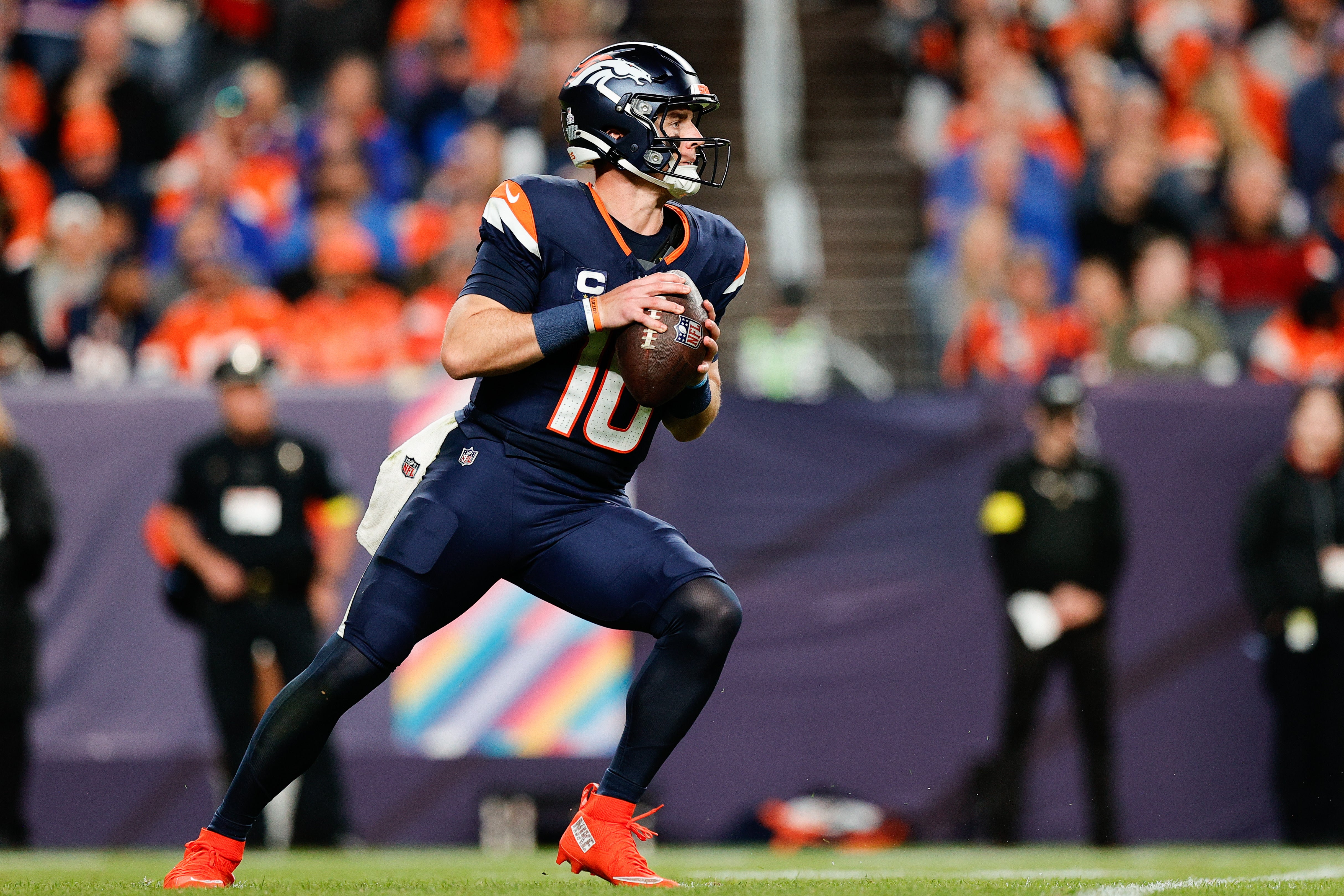 Sep 29, 2025; Denver, Colorado, USA; Denver Broncos quarterback Bo Nix (10) drops back to pass during the third quarter against the Cincinnati Bengals at Empower Field at Mile High.
