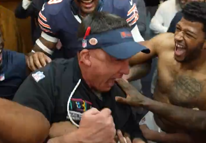 Dennis Allen celebrates with Chicago Bears players following Week 7 win.