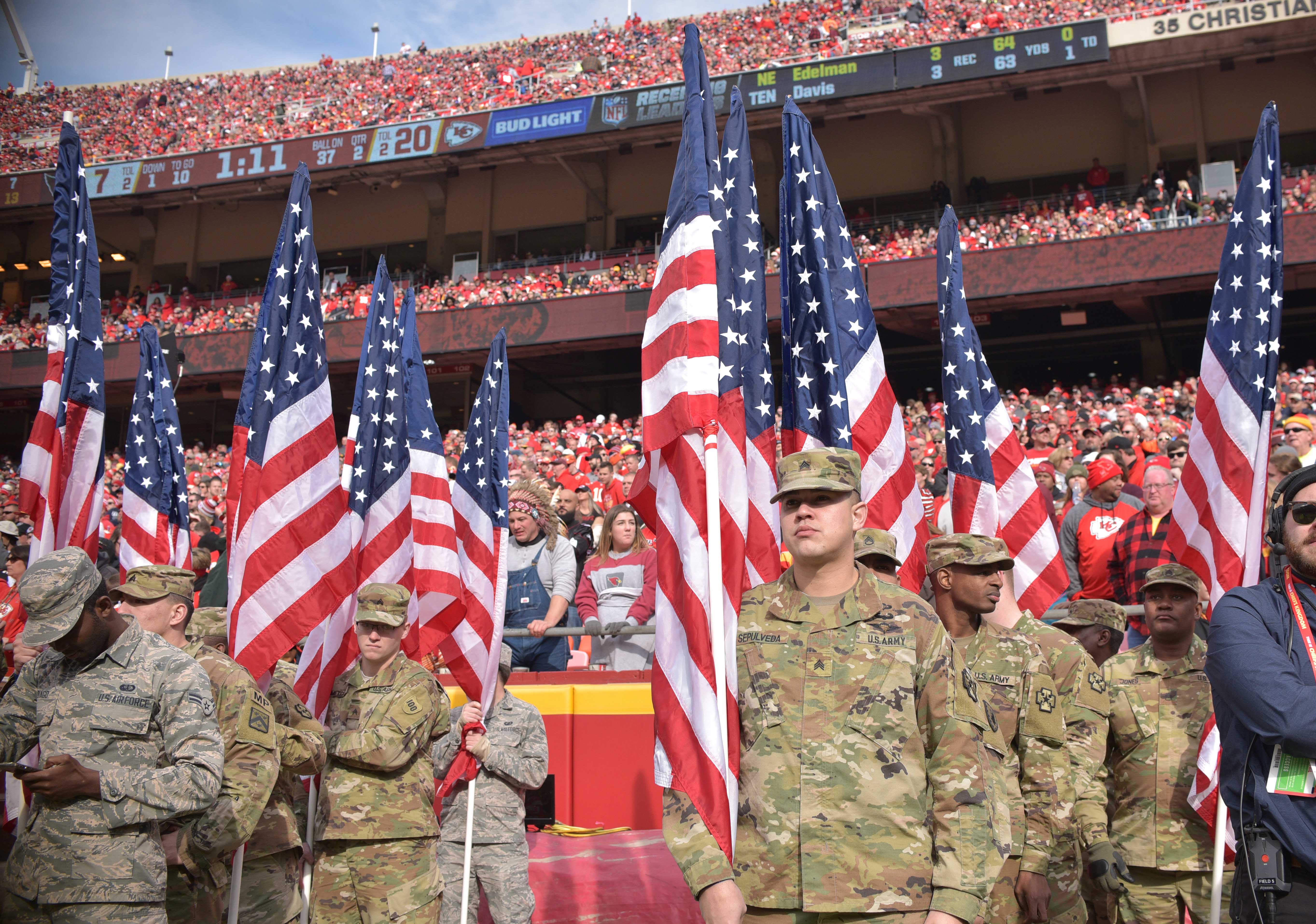 Members of the Armed Forces prepare to go onto the field as part of the NFL Salute to Service day halftime of the game between the Kansas City Chiefs and Arizona Cardinals at Arrowhead Stadium.