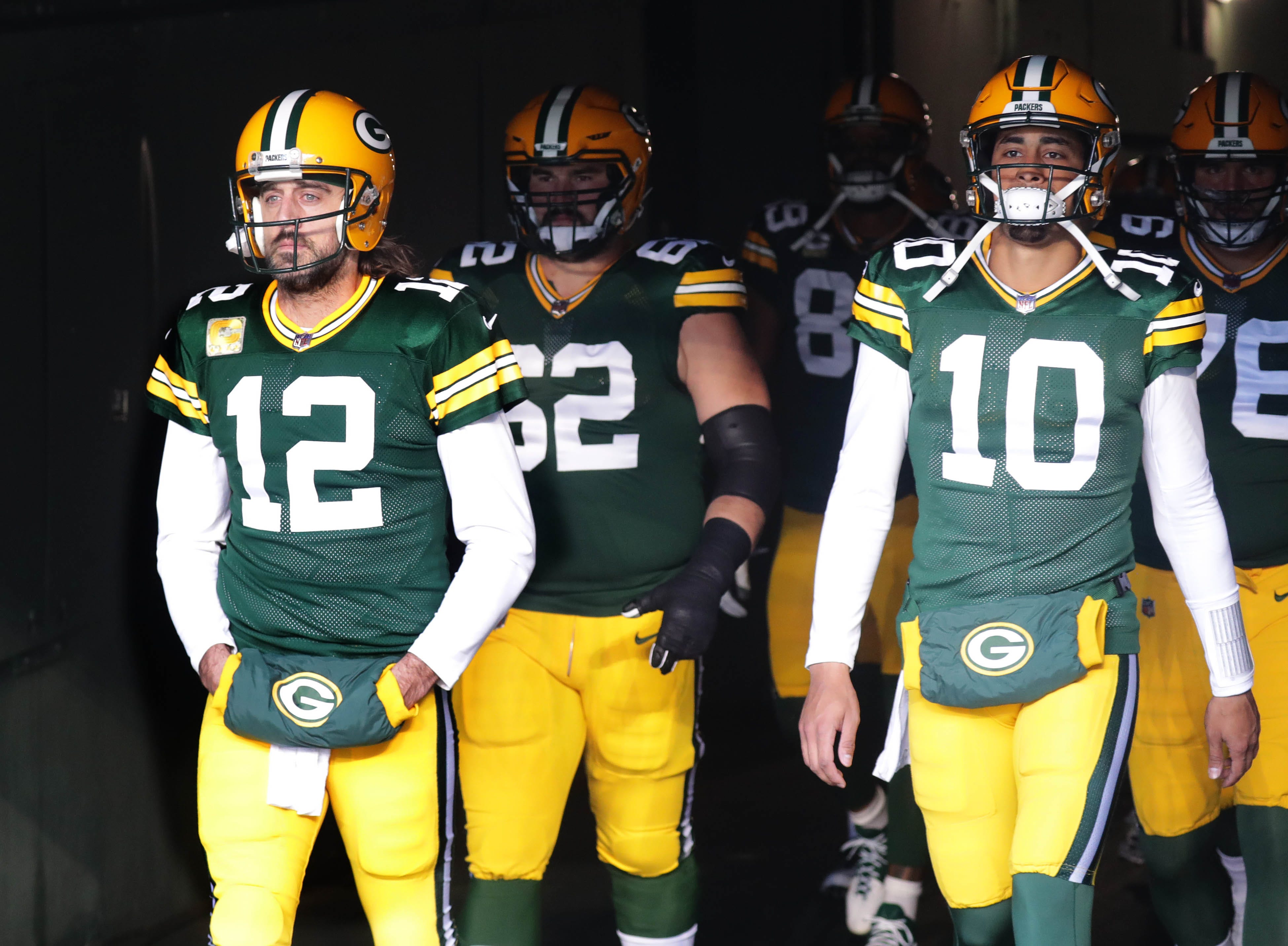 Green Bay Packers quarterback Aaron Rodgers (12) walks onto the field with Green Bay Packers quarterback Jordan Love (10) and other teammates before the Green Bay Packers play the Seattle Seahawks at Lambeau Field in Green Bay on Sunday, Nov. 14, 2021.