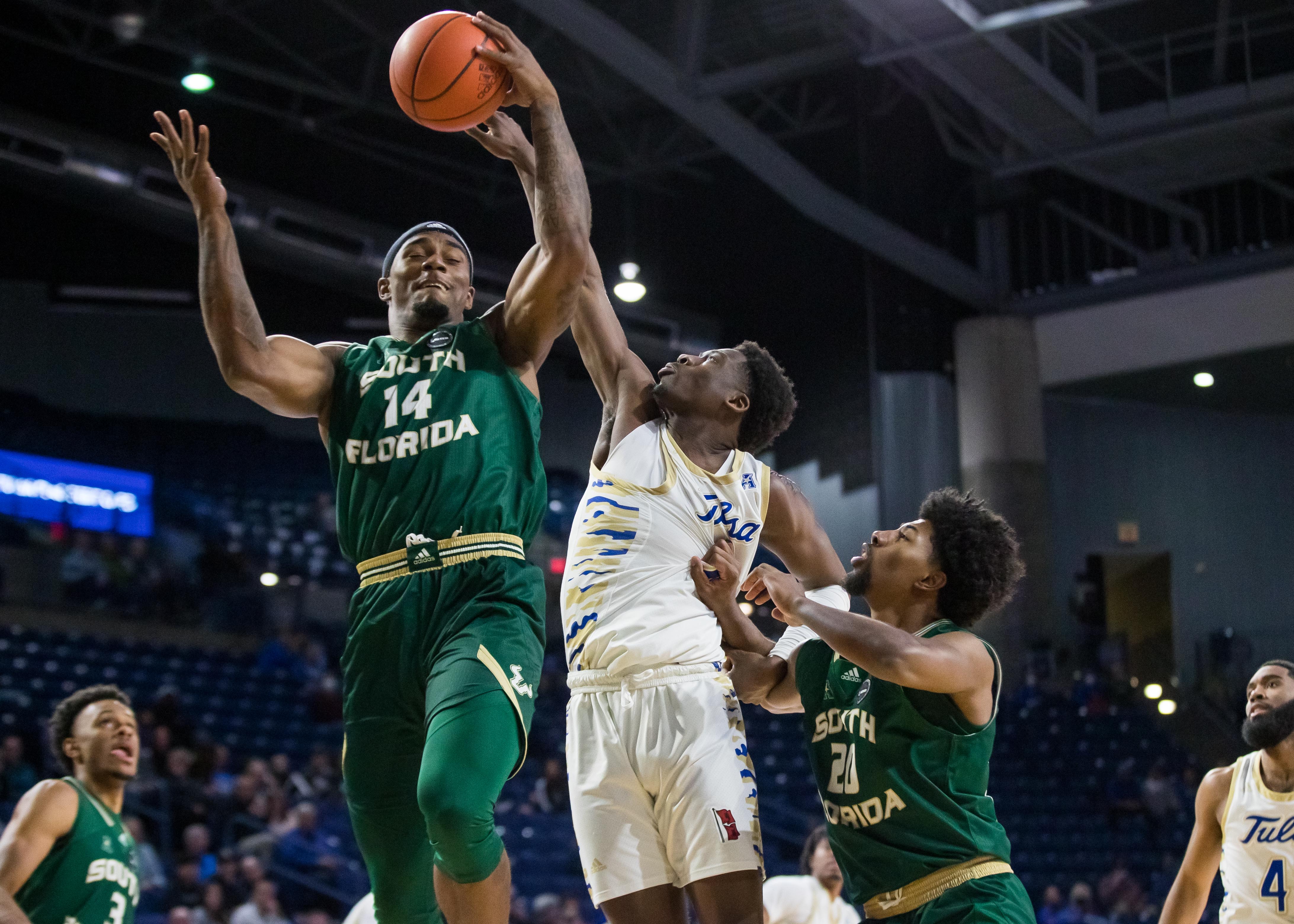 South Florida forward Bayron Matos goes up for a rebound