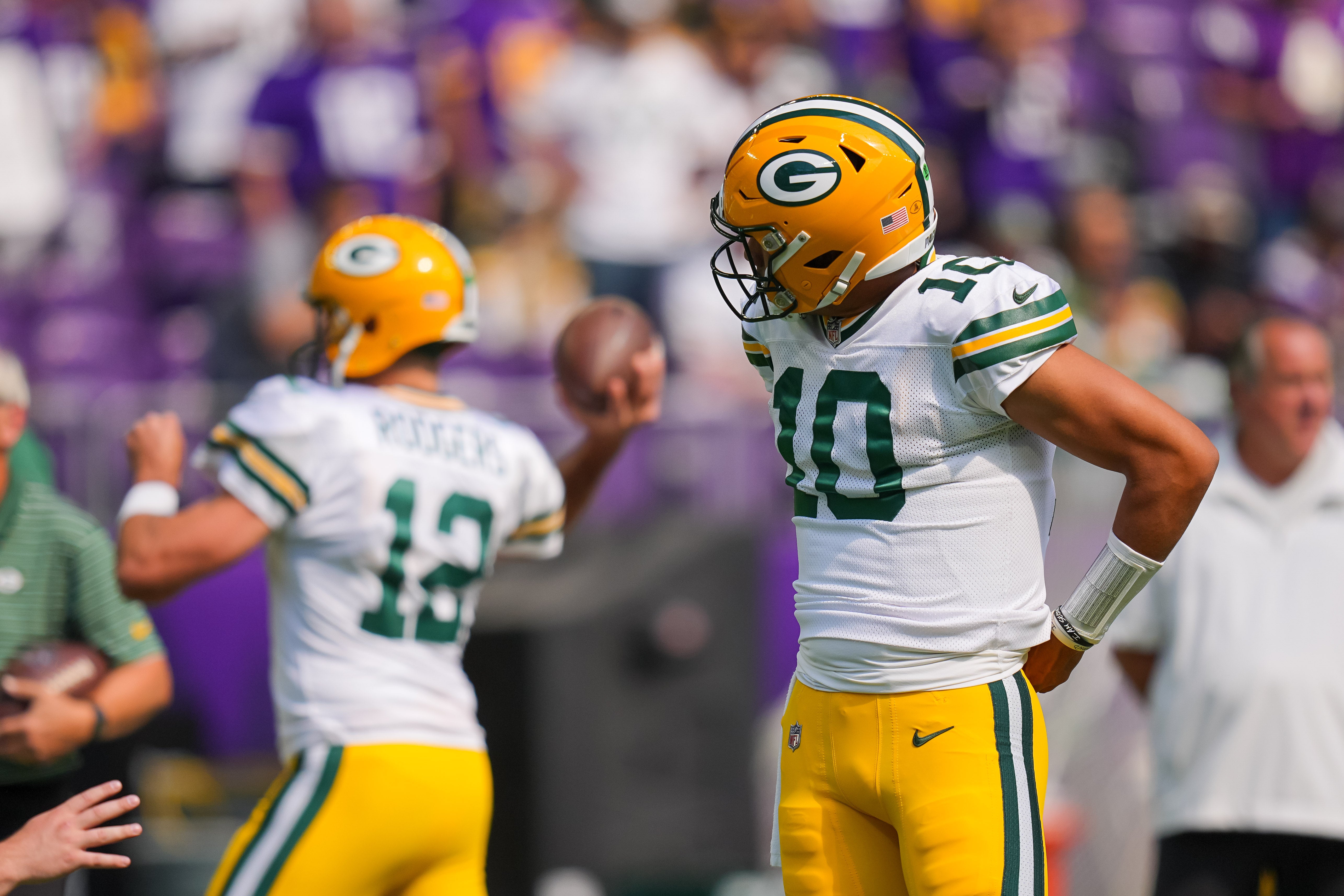 Sep 11, 2022; Minneapolis, Minnesota, USA; Green Bay Packers quarterback Jordan Love (10) watches quarterback Aaron Rodgers (12) warm up before the game against the Minnesota Vikings at U.S. Bank Stadium.