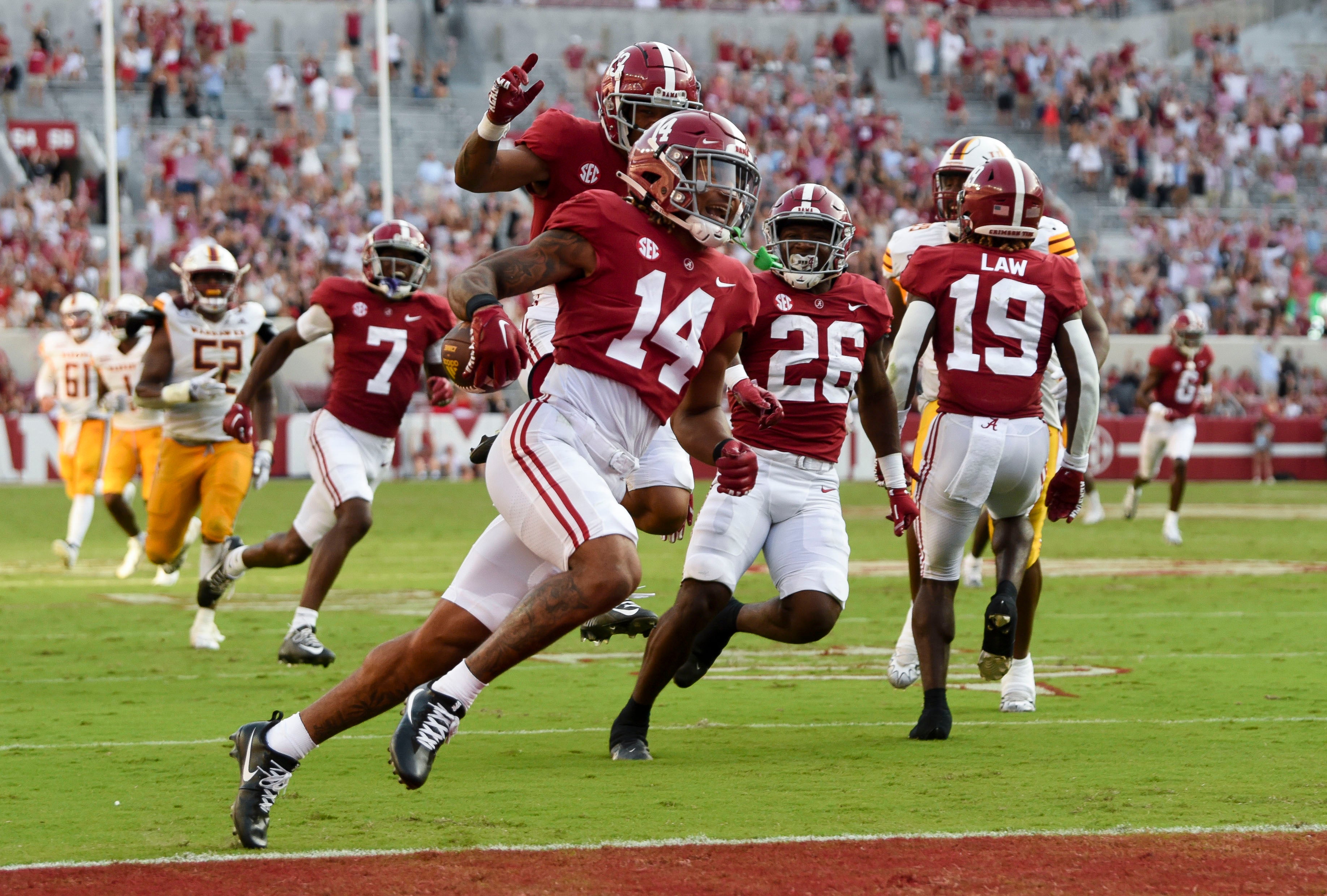 Sep 17, 2022; Tuscaloosa, Alabama, USA; Alabama Crimson Tide defensive back Brian Branch (14) returns a punt for a touchdown against the UL Monroe Warhawks at Bryant-Denny Stadium. Alabama won 63-7.