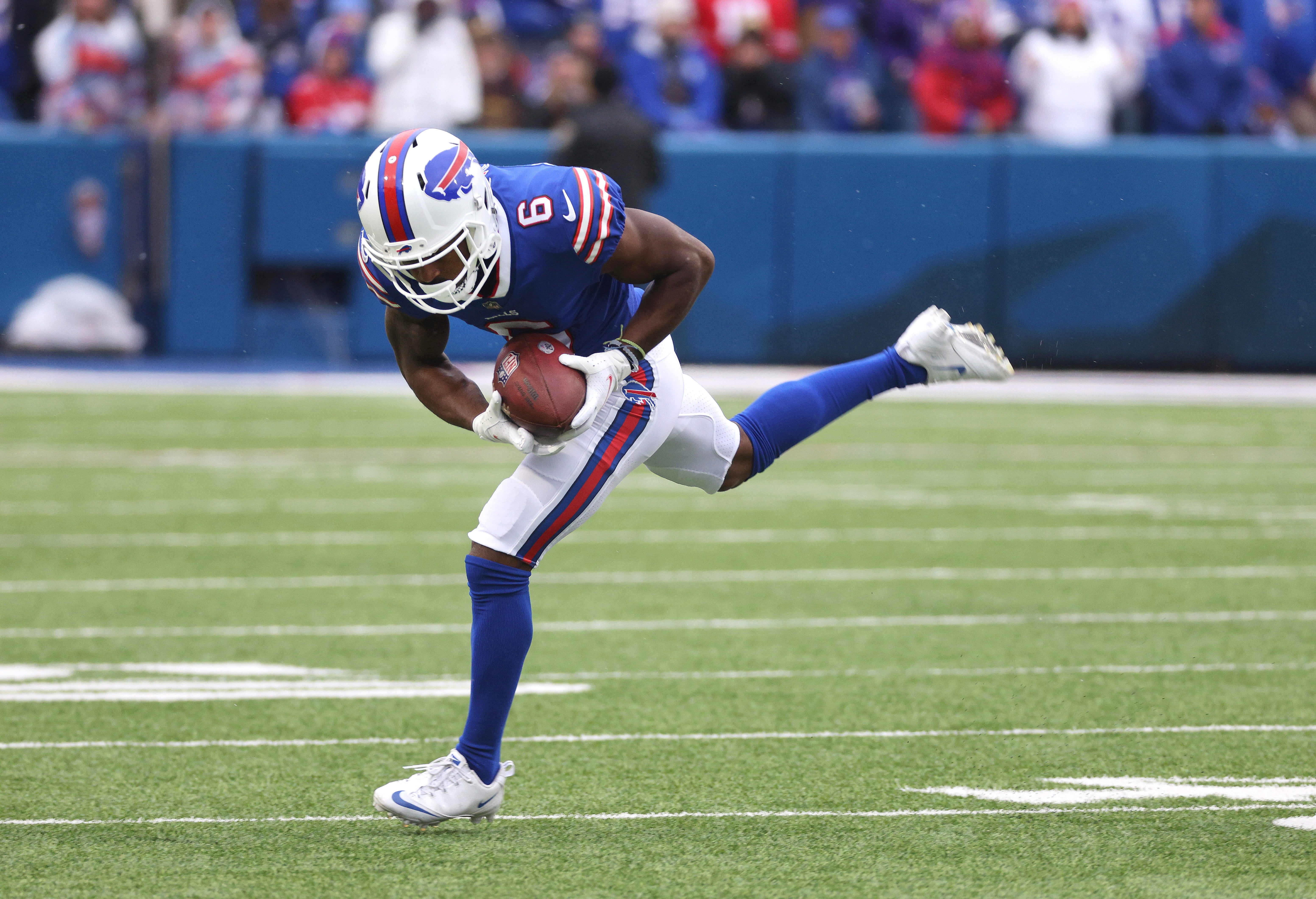 Bills receiver Isaiah McKenzie makes a catch in the open field.
