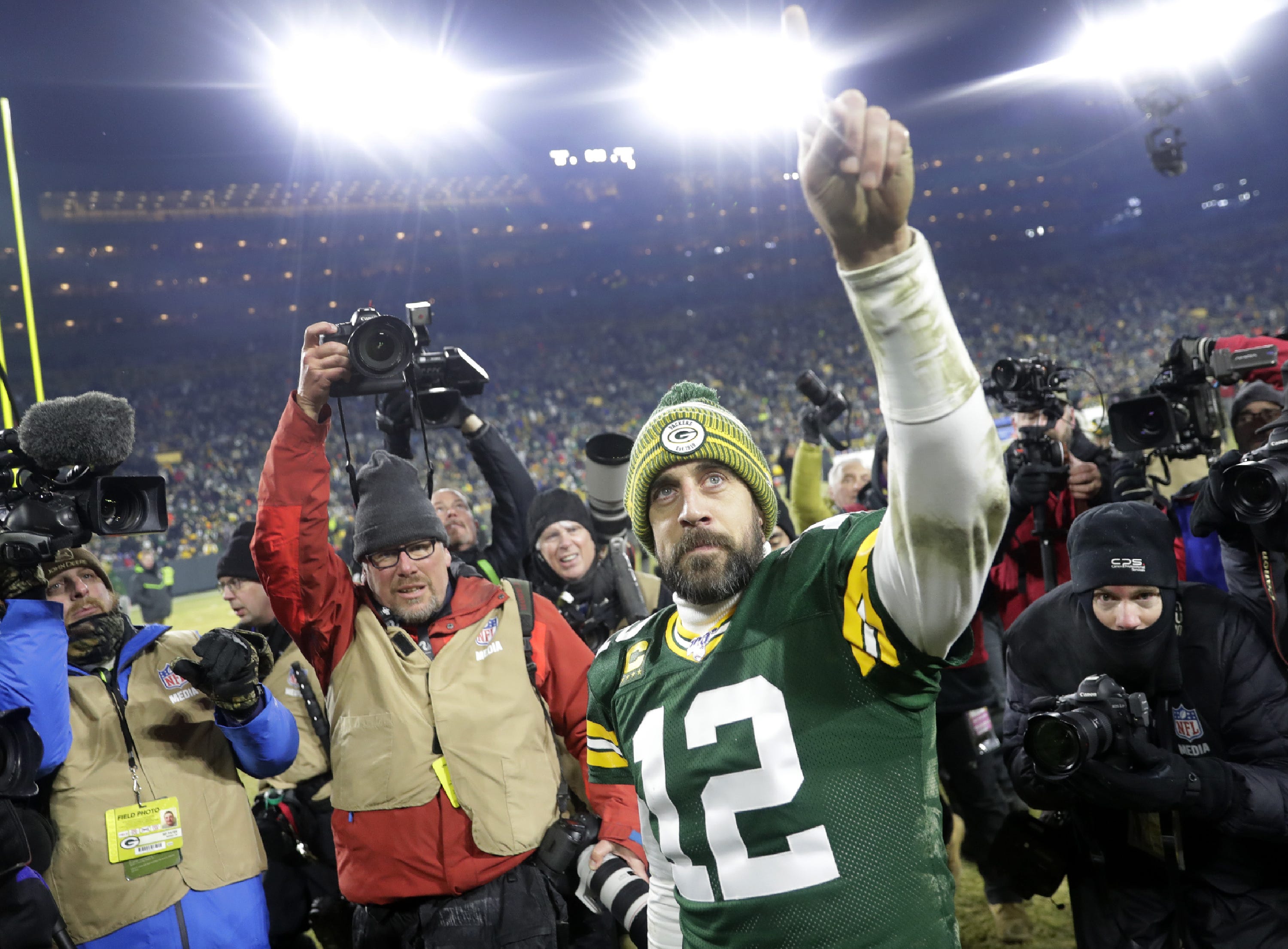 Green Bay Packers quarterback Aaron Rodgers (12) leaves the field following the Packers' victory over the Seattle Seahawks during their NFC divisional round playoff football game on Sunday, January 12, 2020, at Lambeau Field in Green Bay, Wis. Green Bay defeated Seattle 28-23.