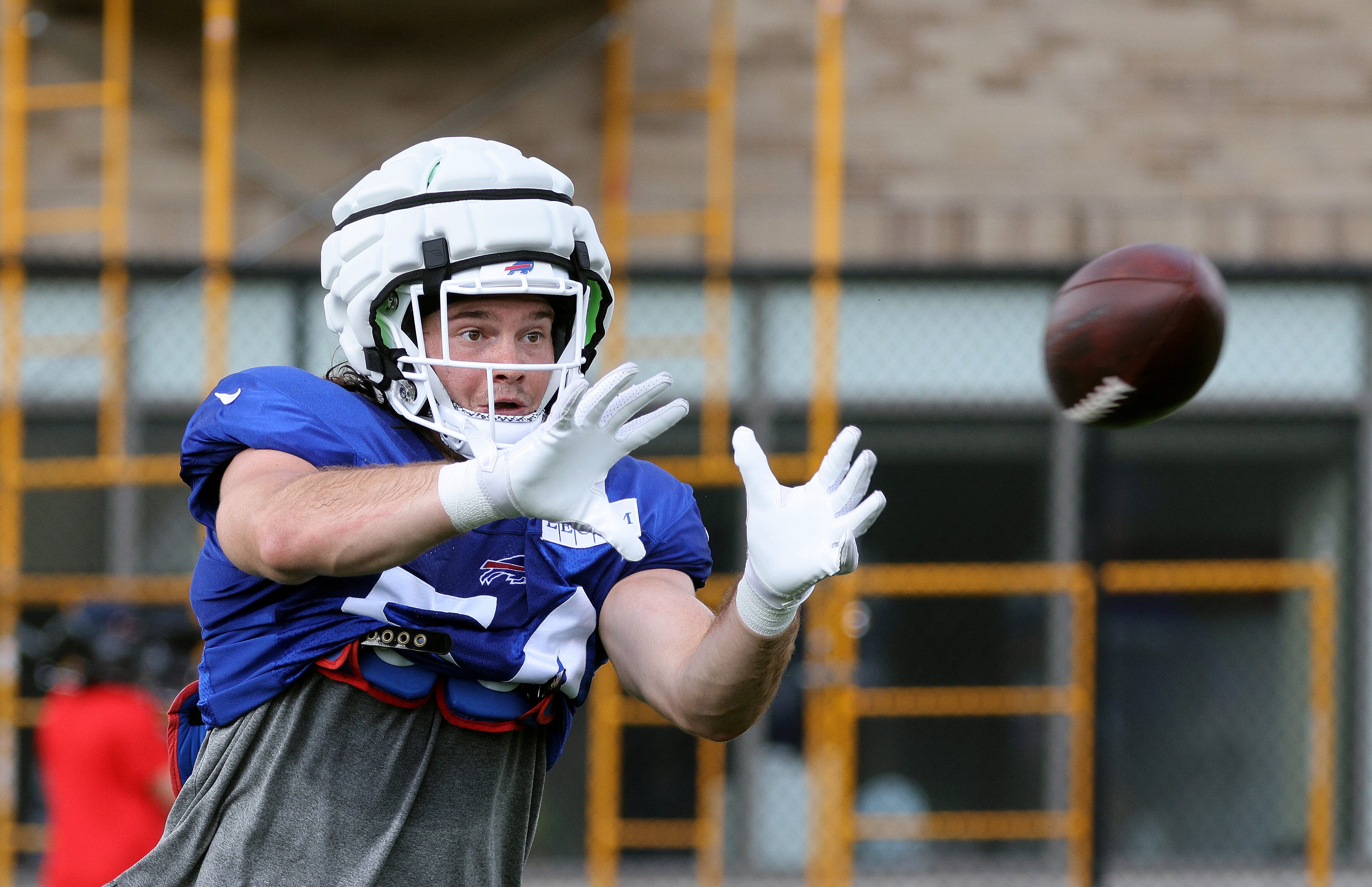 Linebacker Baylon Spector catches passes during training camp drills.