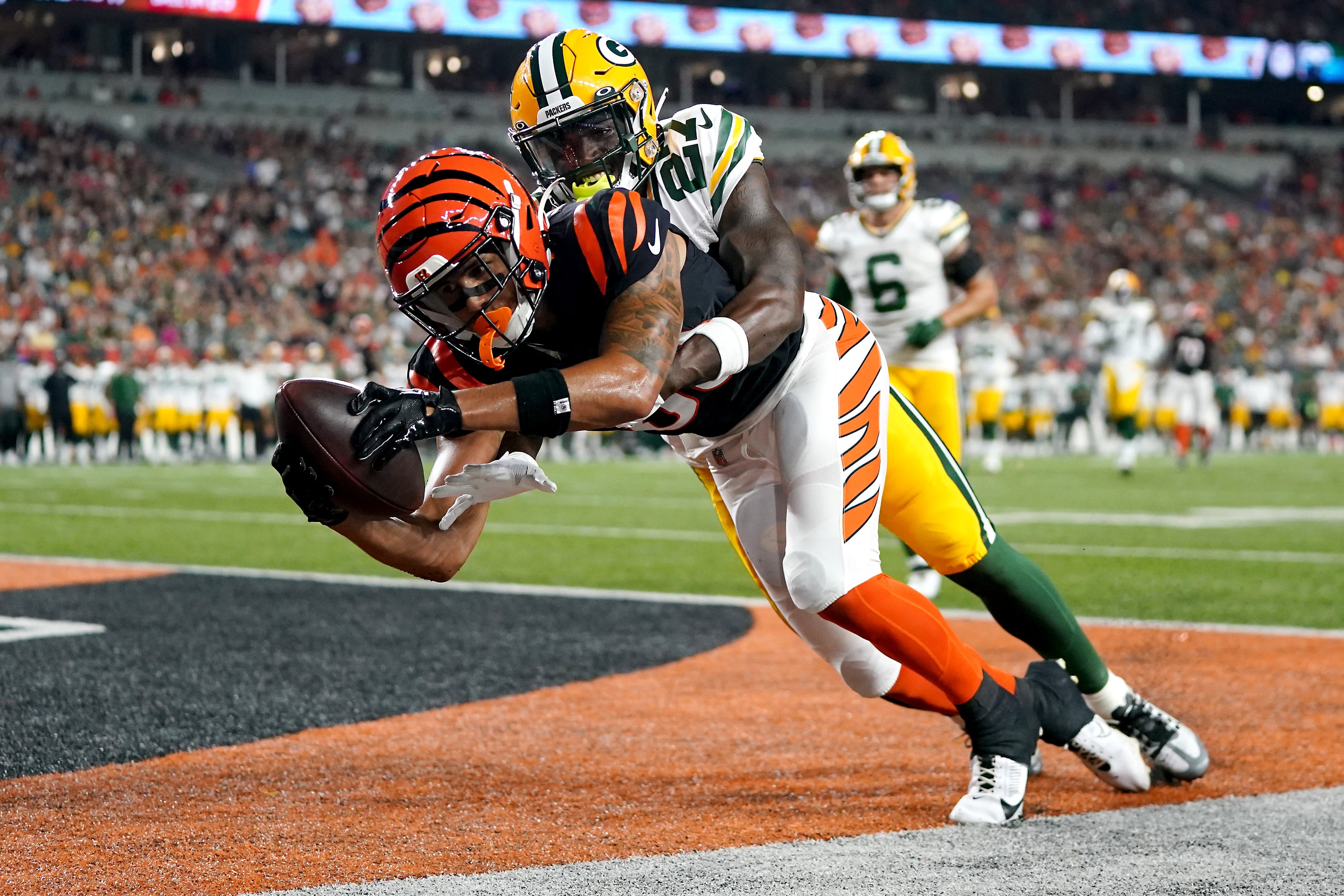 Aug. 11: Cincinnati Bengals wide receiver Andrei Iosivas (80) tries to come down with a catch in the end zone as Green Bay Packers cornerback William Hooper (27) defends. The pass was ruled incomplete.