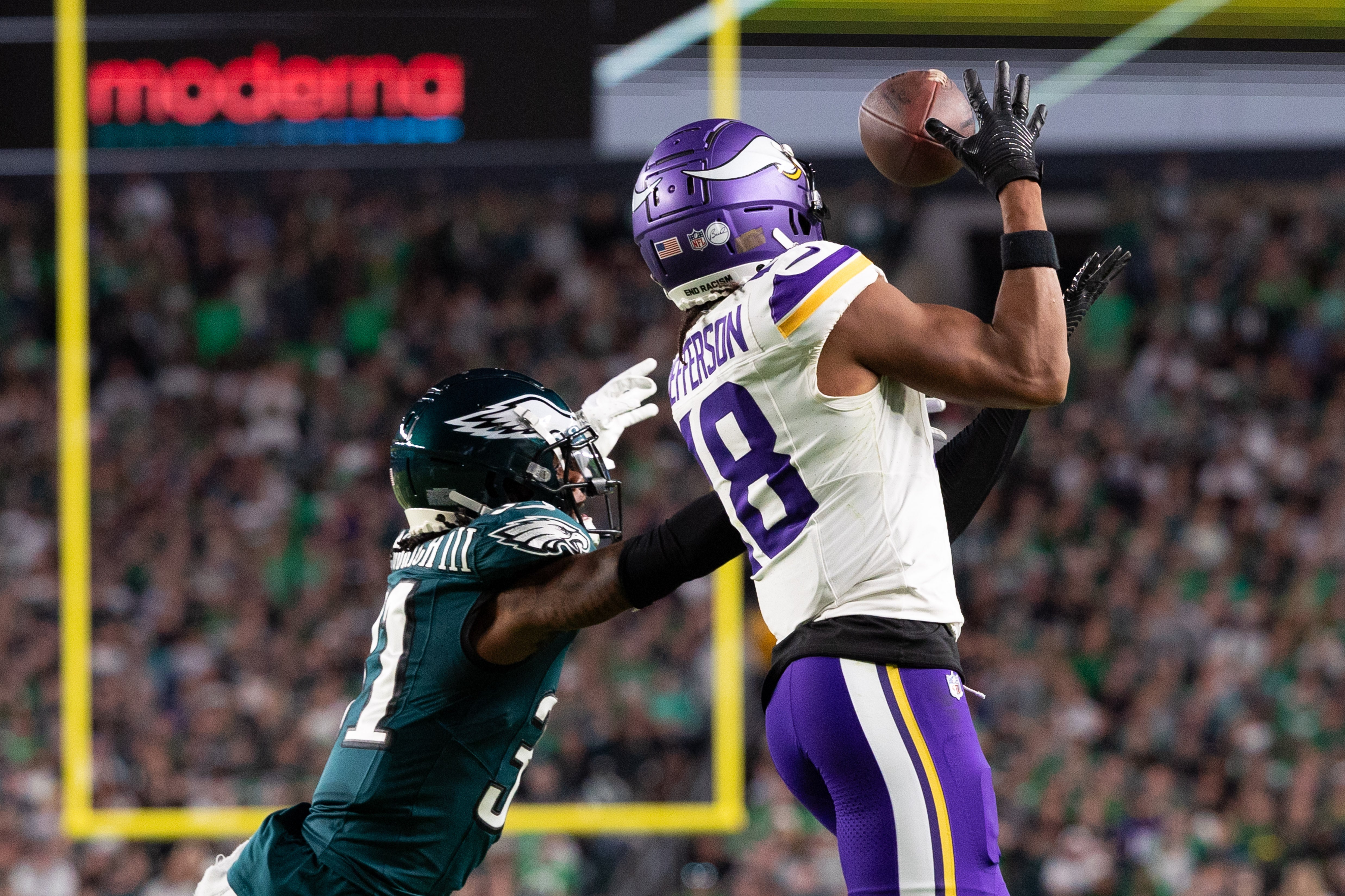 Sep 14, 2023; Philadelphia, Pennsylvania, USA; Minnesota Vikings wide receiver Justin Jefferson (18) makes a catch in front of Philadelphia Eagles cornerback Mario Goodrich (31) during the second quarter at Lincoln Financial Field.