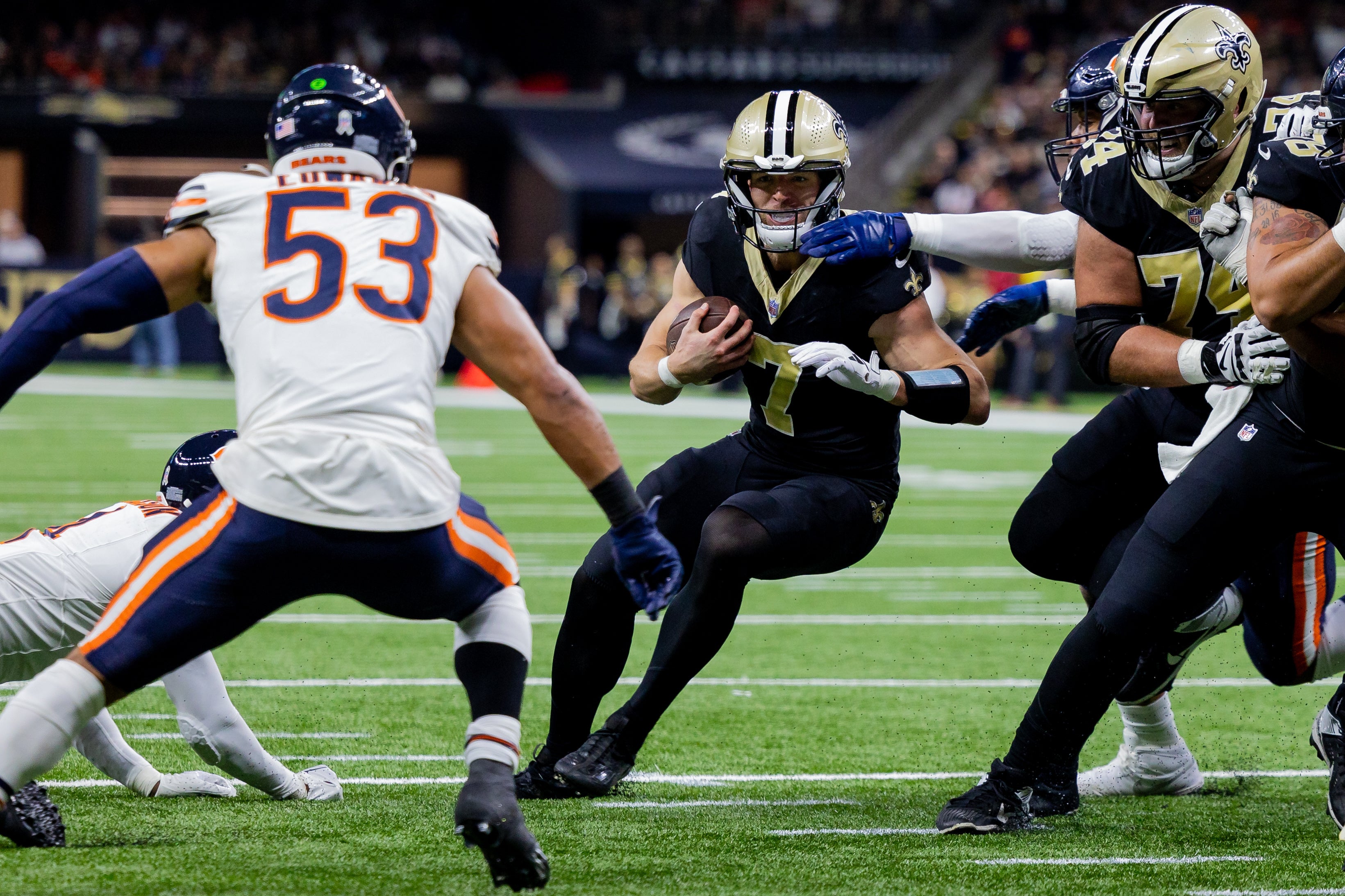 Nov 5, 2023; New Orleans, Louisiana, USA; New Orleans Saints quarterback Taysom Hill (7) is stopped at the 1 yard line by Chicago Bears linebacker T.J. Edwards (53) during the first half at the Caesars Superdome.