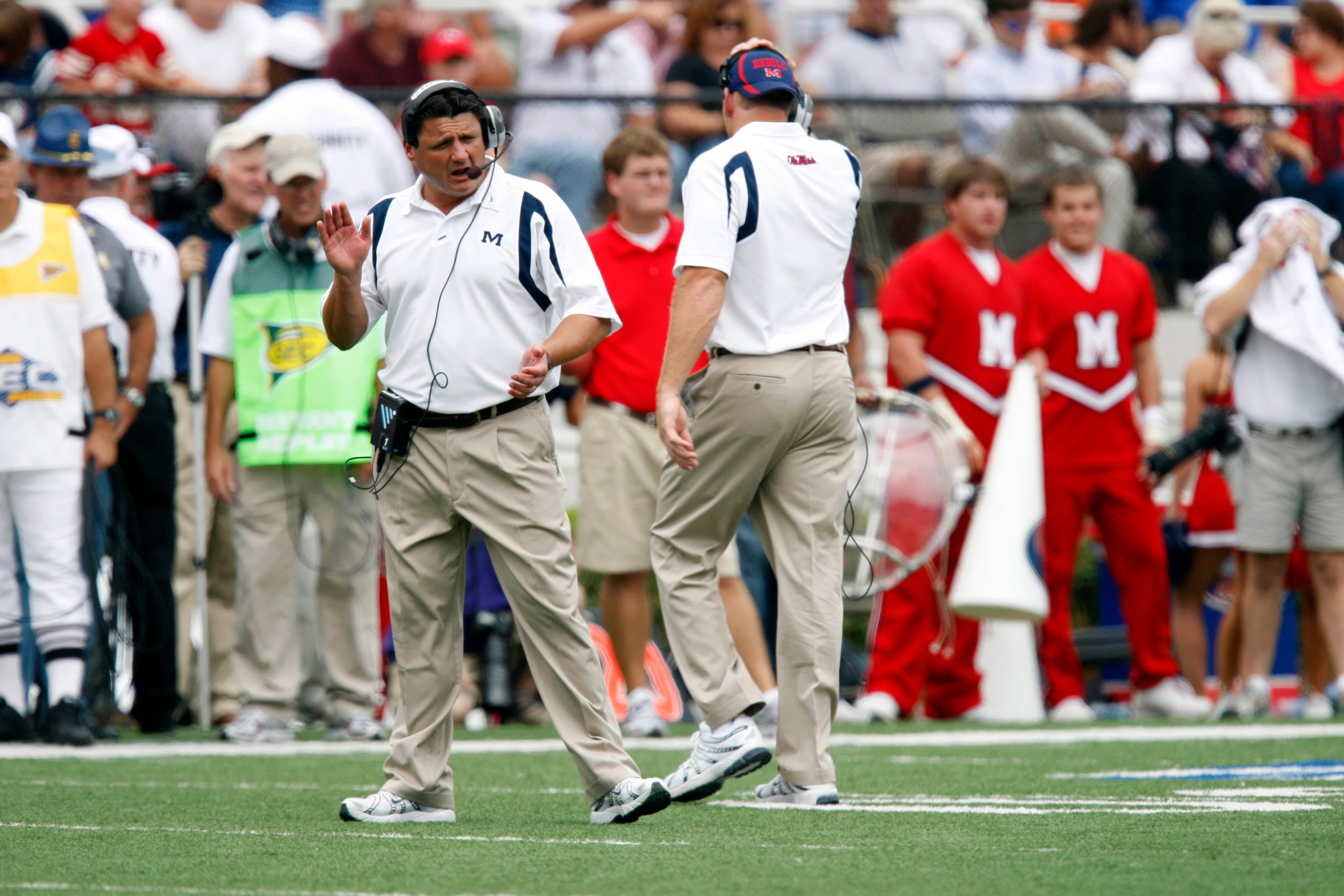 September 22, 2007; Oxford, FL, USA; Mississippi Rebels head coach Ed Orgeron (white shirt) cheers on his players during the game against the Florida Gators in the second quarter at Vaught-Hemingway Stadium. The Gators defeated the Rebels 30 to 24.