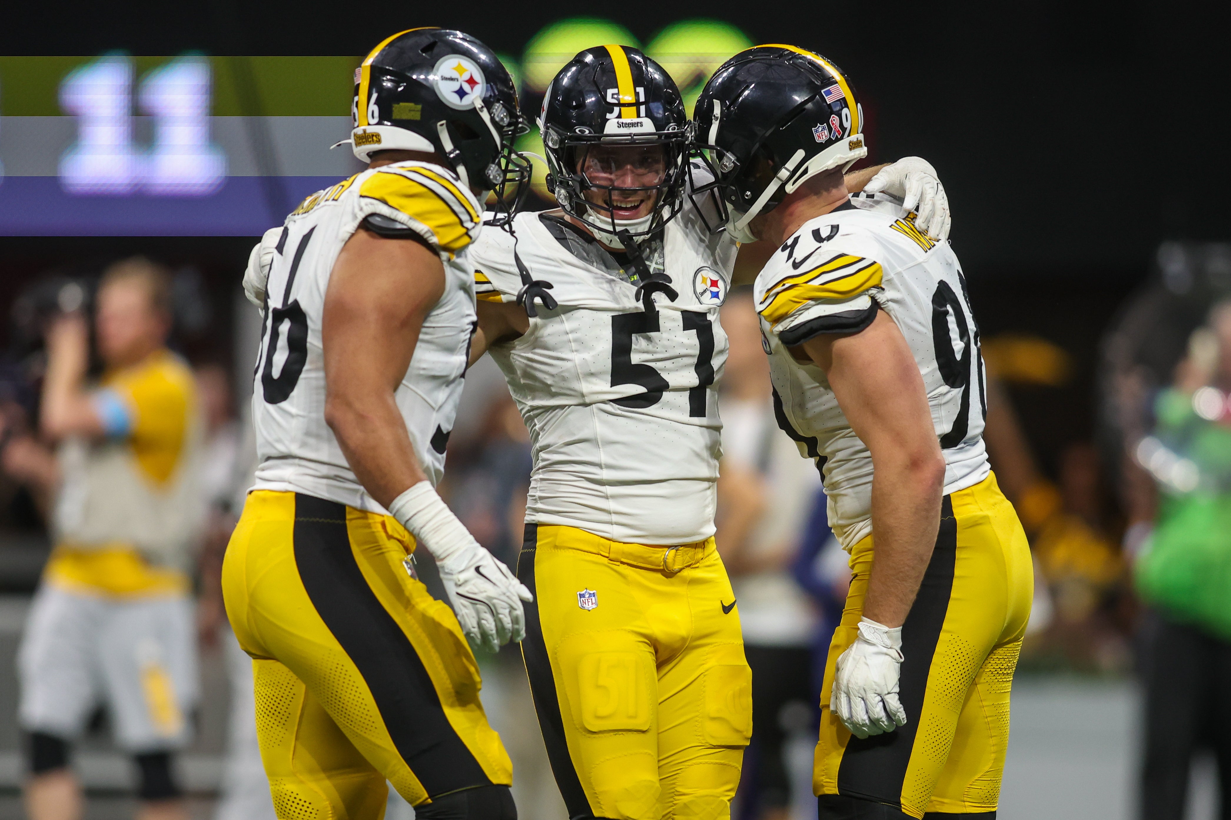 Sep 8, 2024; Atlanta, Georgia, USA; Pittsburgh Steelers linebacker Alex Highsmith (56) and linebacker Nick Herbig (51) and linebacker T.J. Watt (90) celebrate after a victory against the Atlanta Falcons at Mercedes-Benz Stadium