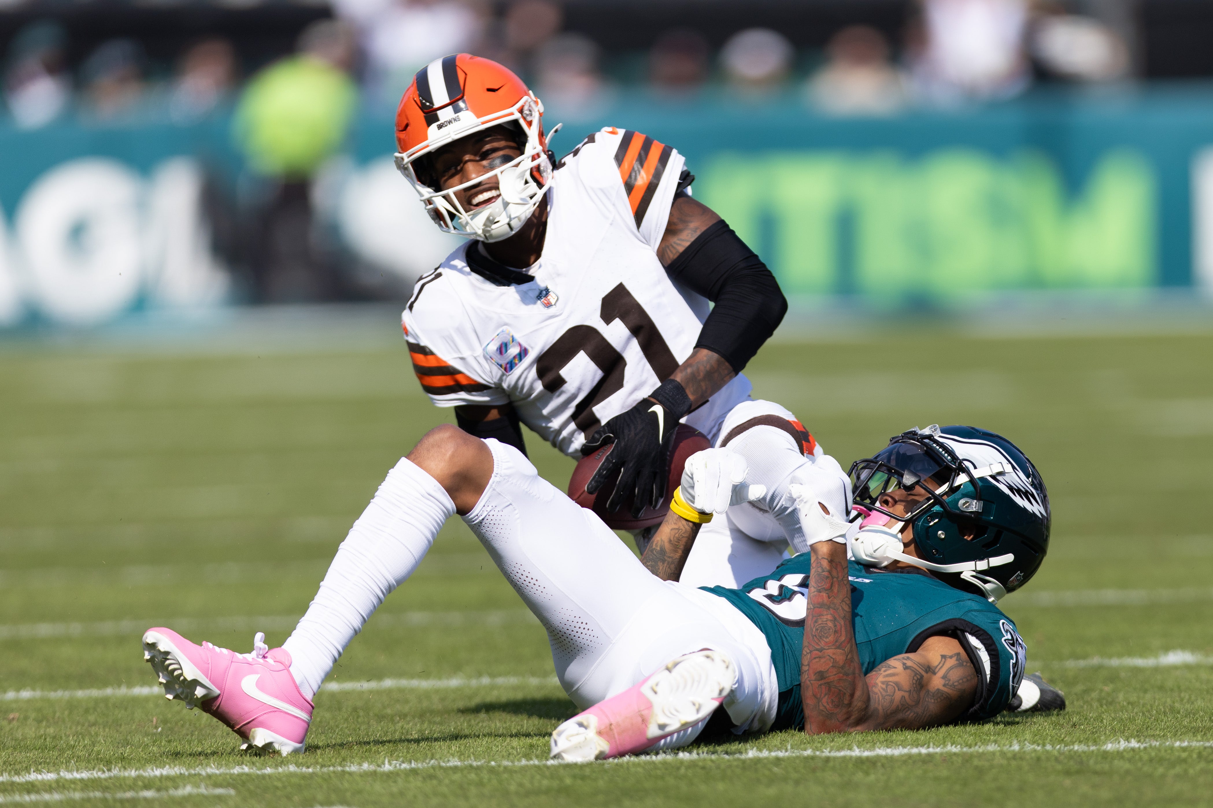 Oct 13, 2024; Philadelphia, Pennsylvania, USA; Cleveland Browns cornerback Denzel Ward (21) breaks up a pass to Philadelphia Eagles wide receiver DeVonta Smith (6) during the first quarter at Lincoln Financial Field.