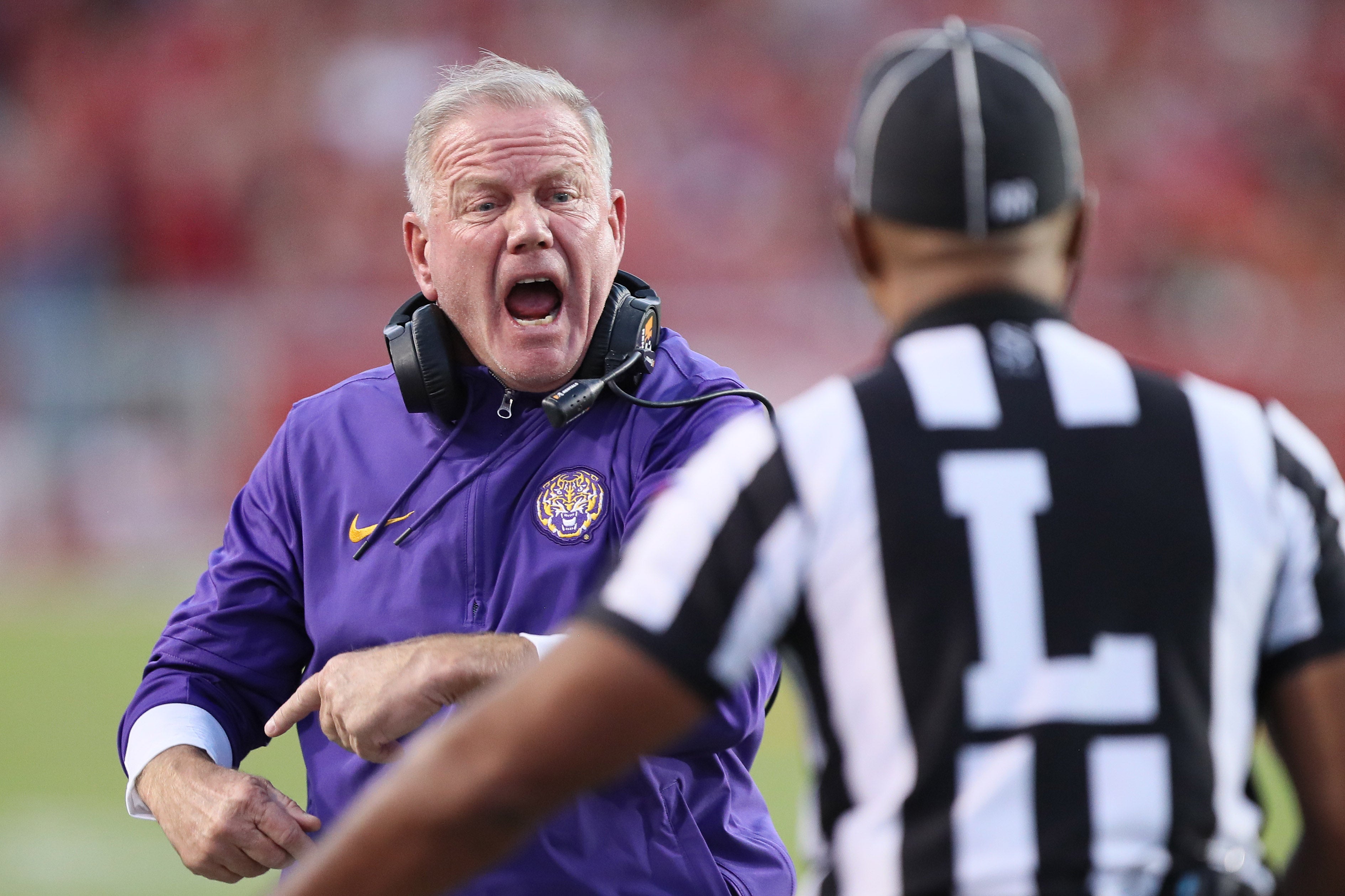 Oct 19, 2024; Fayetteville, Arkansas, USA; LSU Tigers head coach Brian Kelly reacts to a call in the first half against the Arkansas Razorbacks at Donald W. Reynolds Razorback Stadium. Mandatory Credit: Nelson Chenault-Imagn Images