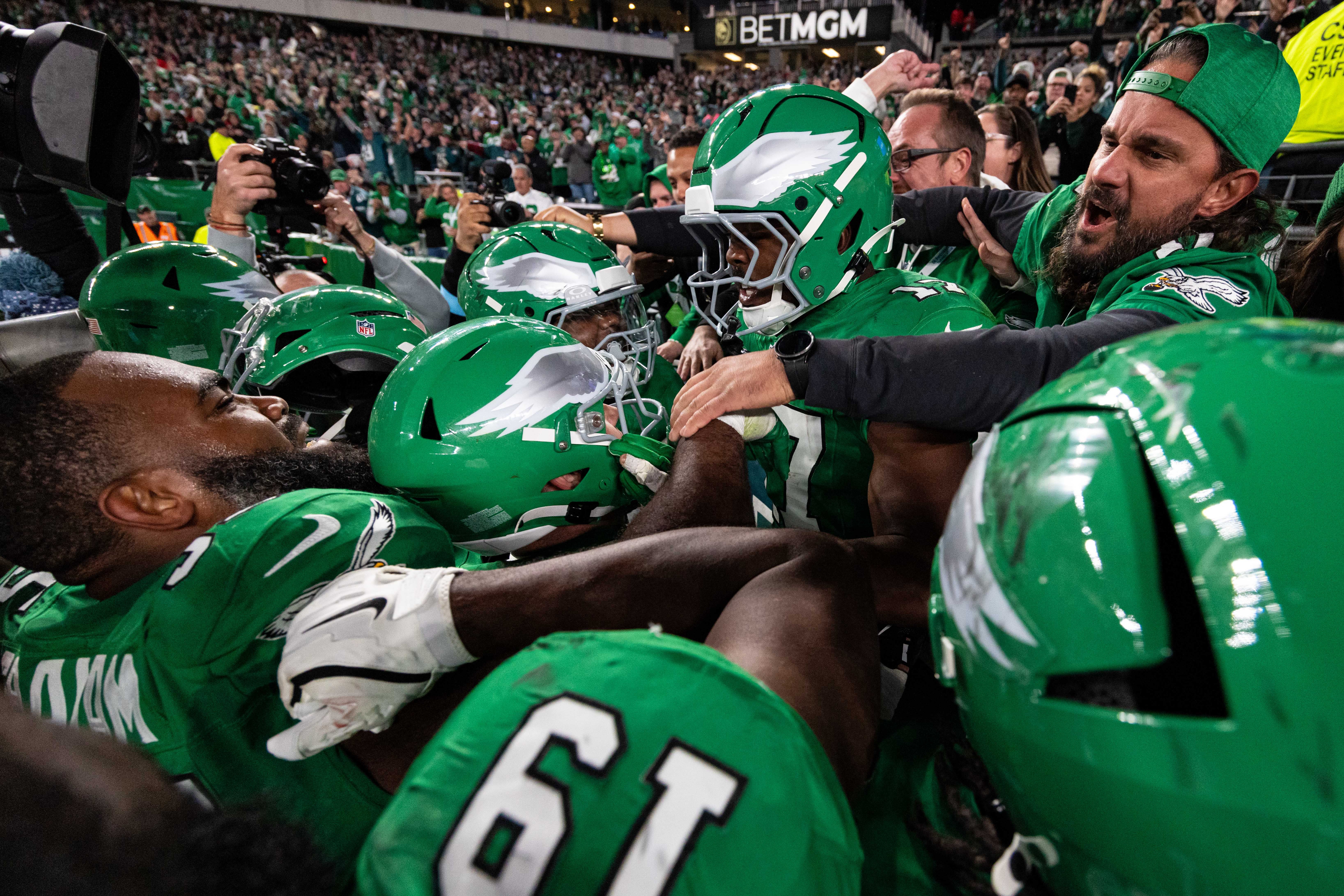 Philadelphia Eagles linebacker Nakobe Dean (17) celebrates with teammates and fans after an interception late in the fourth quarter against the Jacksonville Jaguars at Lincoln Financial Field.