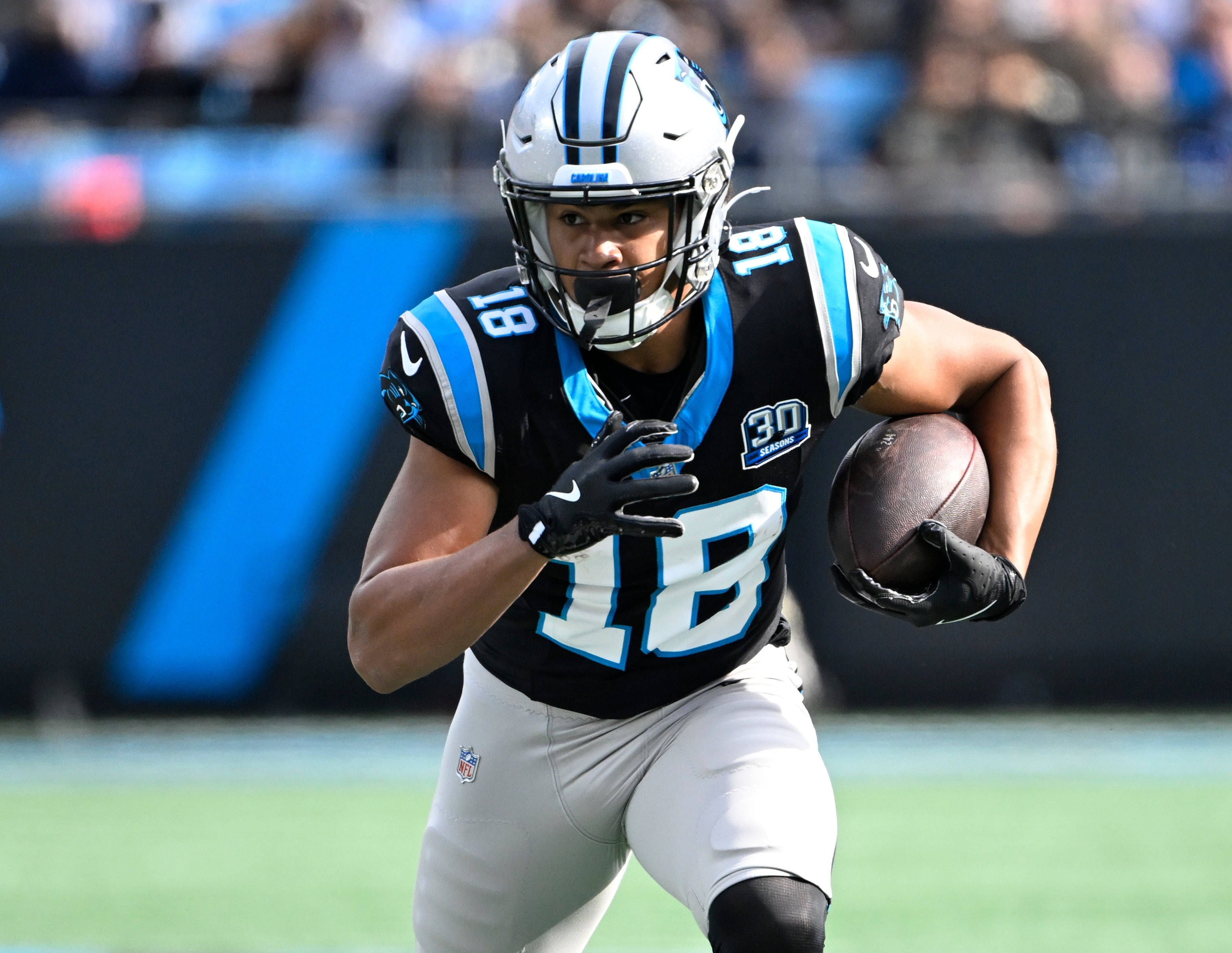 Nov 3, 2024; Charlotte, North Carolina, USA; Carolina Panthers wide receiver Jalen Coker (18) with the ball in the second quarter at Bank of America Stadium.