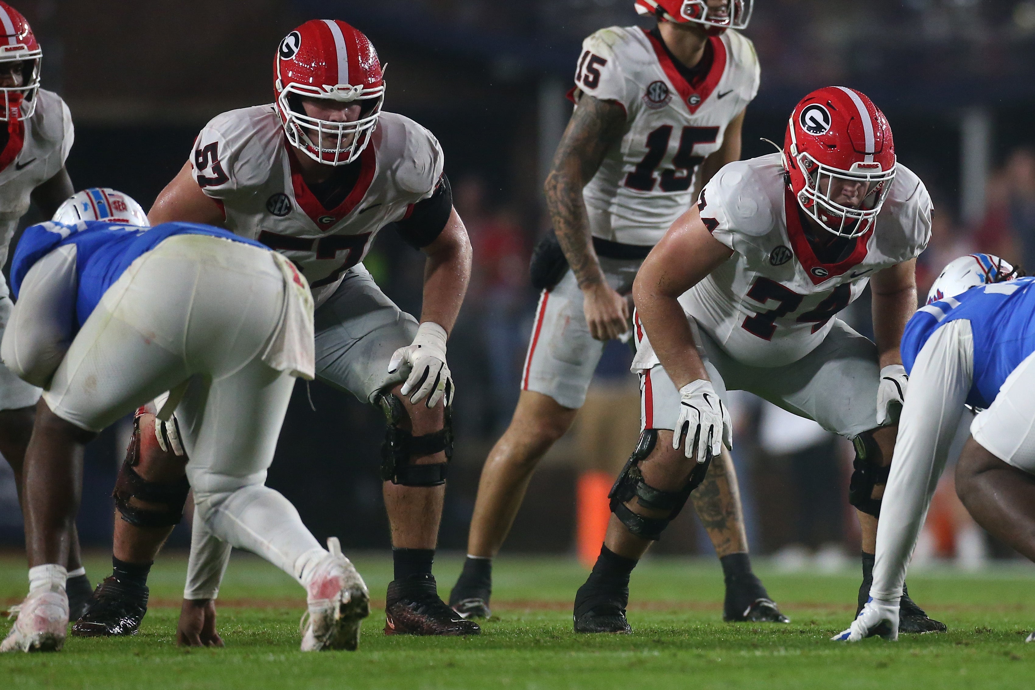 Georgia Bulldogs offensive lineman Monroe Freeling (57) and offensive lineman Drew Bobo (74) wait for the snap against the Mississippi Rebels during the second half at Vaught-Hemingway Stadium.