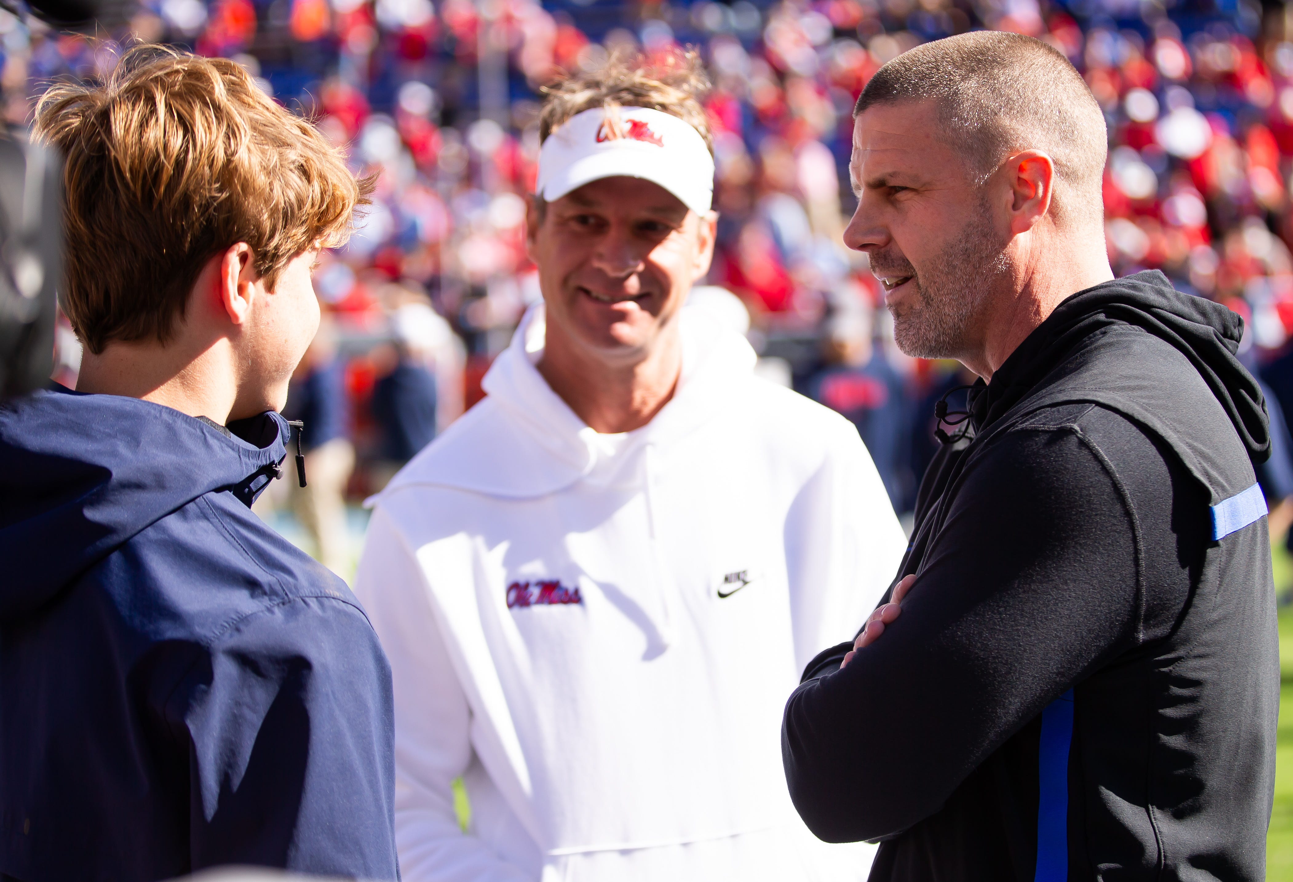 Florida Gators head coach Billy Napier talks with Mississippi Rebels head coach Lane Kiffin before the start of the game at Ben Hill Griffin Stadium in Gainesville, FL on Saturday, November 23, 2024.