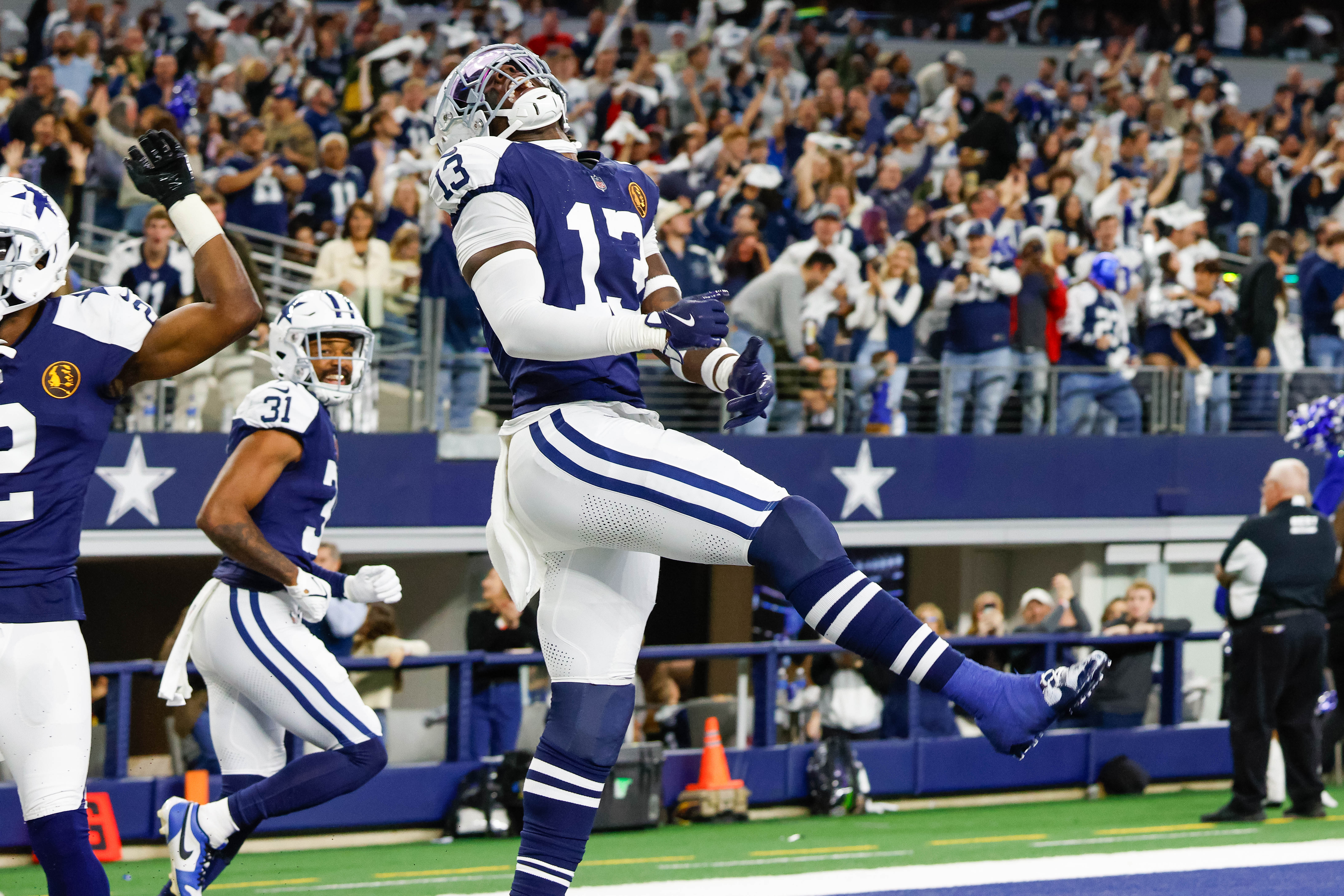 Nov 28, 2024; Arlington, Texas, USA; Dallas Cowboys linebacker DeMarvion Overshown celebrates his interception touchdown return during the second quarter against the New York Giants at AT&T Stadium.