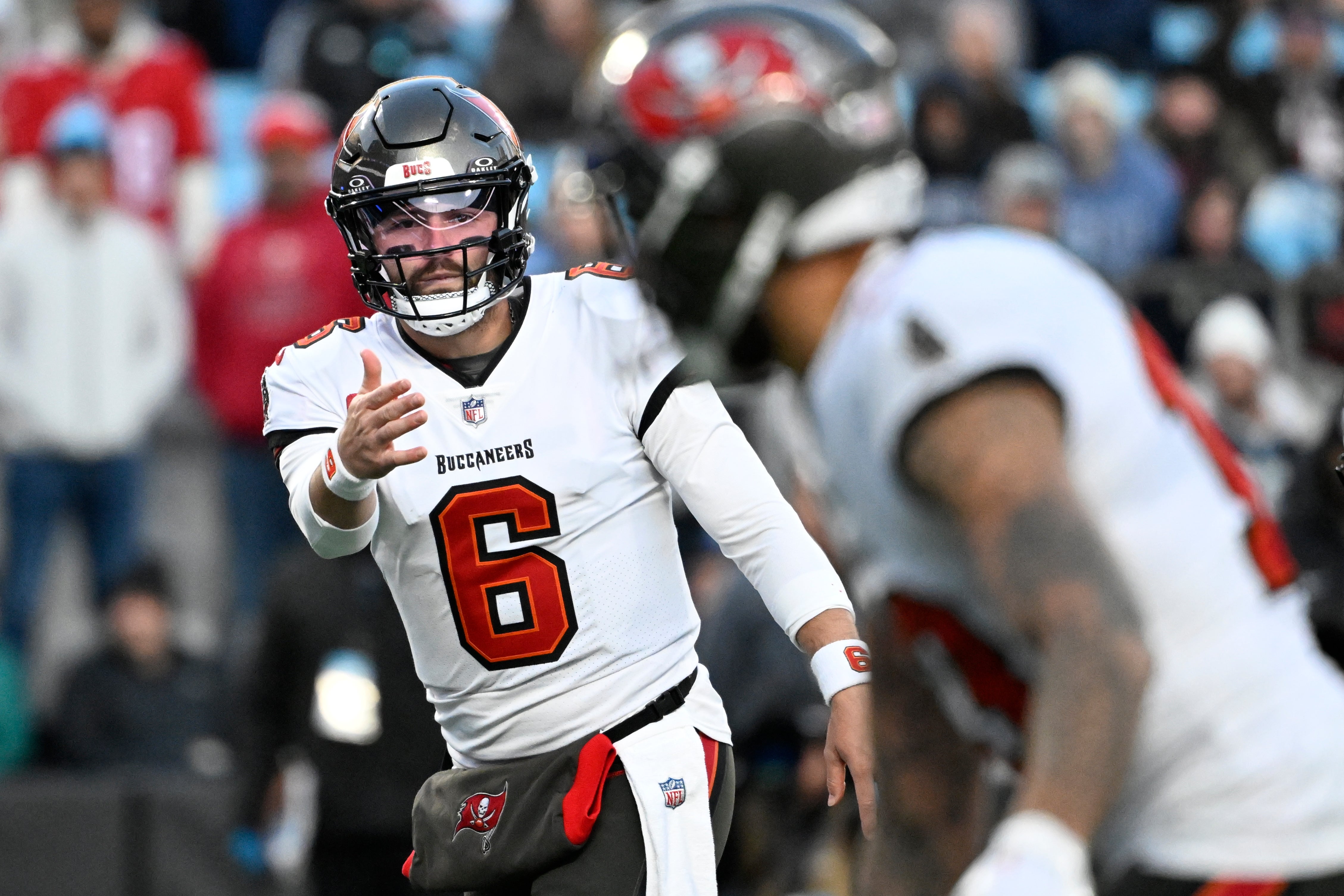 Dec 1, 2024; Charlotte, North Carolina, USA; Tampa Bay Buccaneers quarterback Baker Mayfield (6) signals to wide receiver Mike Evans (13) in the first quarter at Bank of America Stadium.