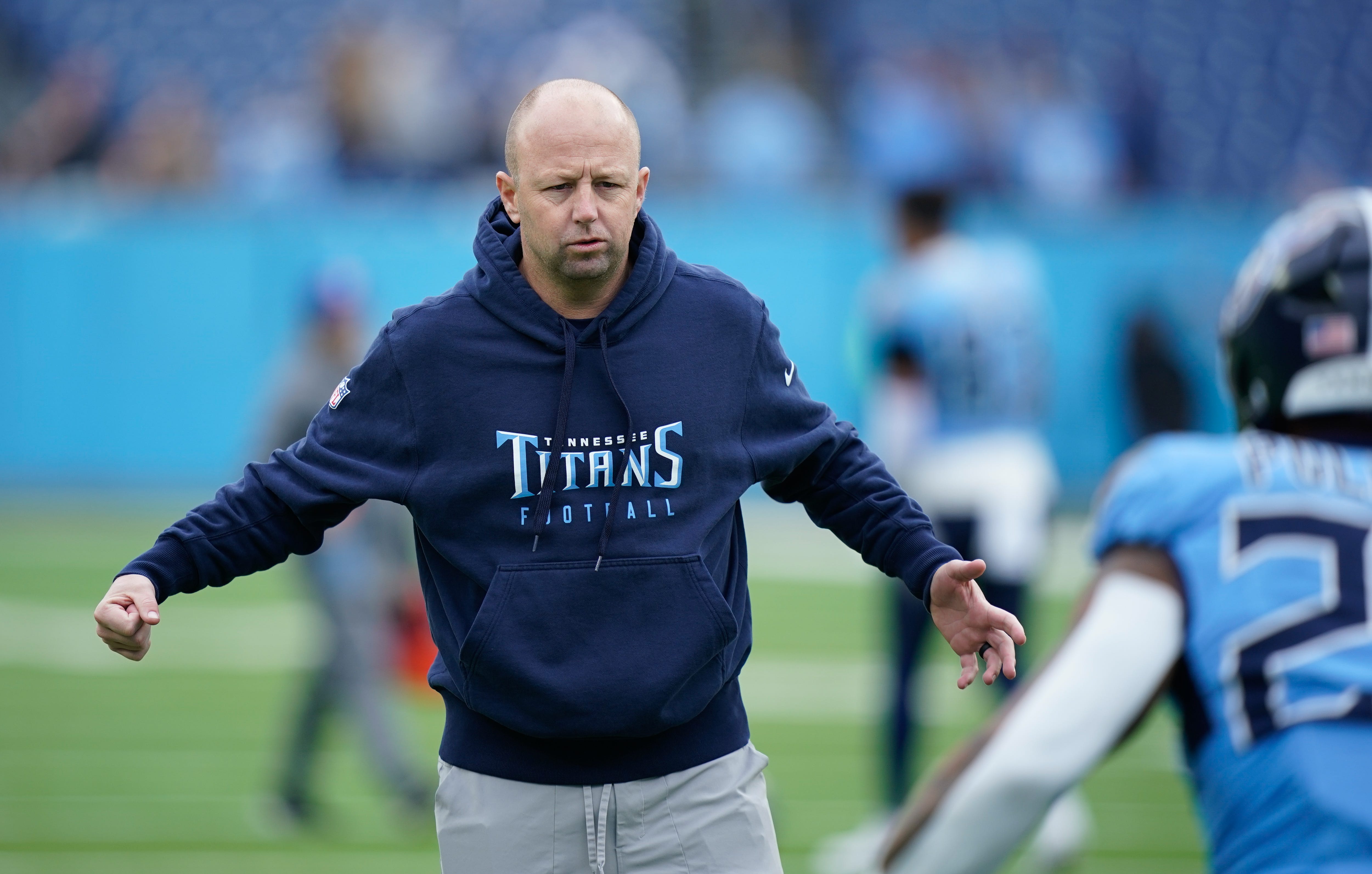 Tennessee Titans offensive coordinator Nick Holz runs the warm up drills at Nissan Stadium in Nashville, Tenn., Sunday, Dec. 8, 2024.