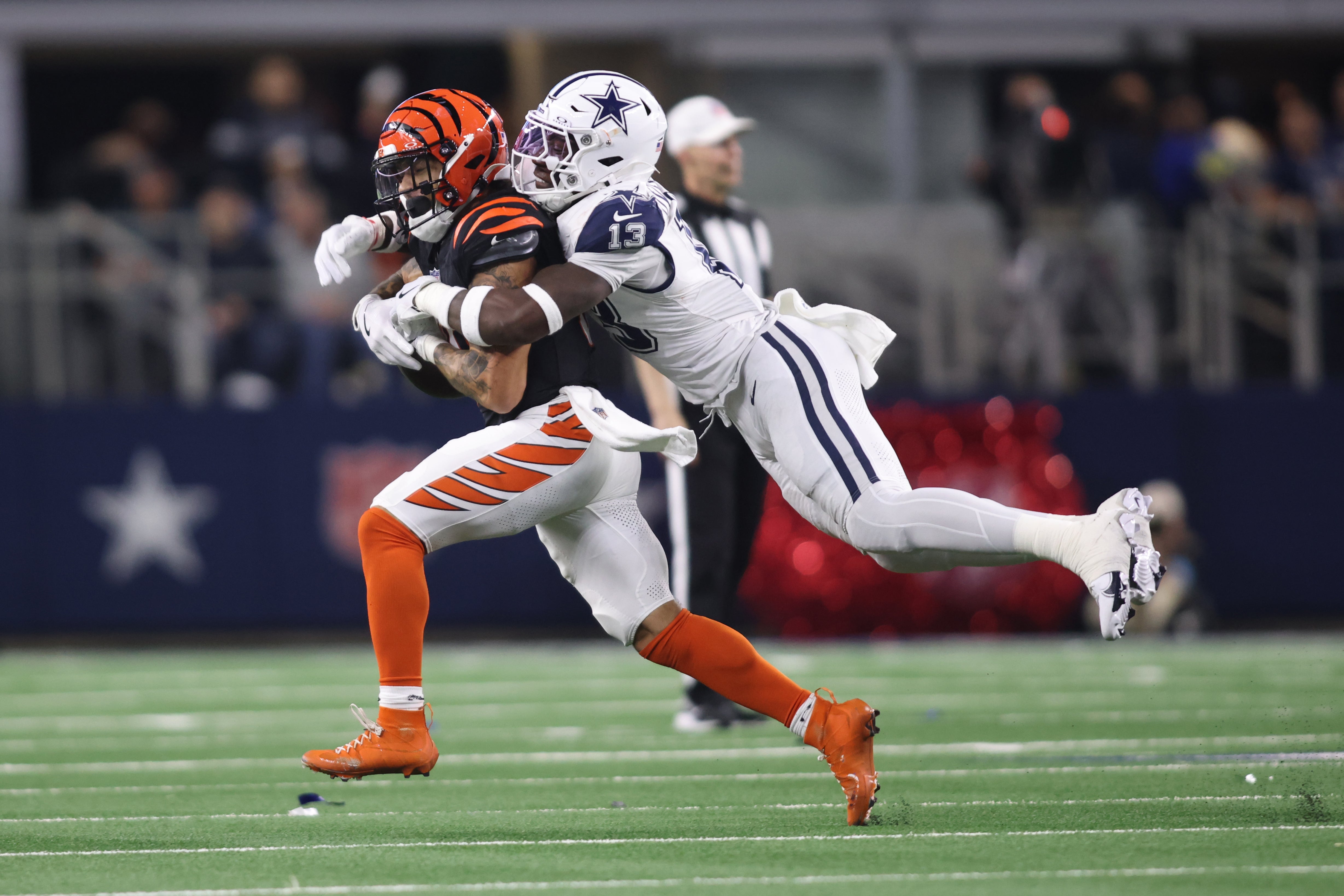 Dec 9, 2024; Arlington, Texas, USA; Dallas Cowboys linebacker DeMarvion Overshown (13) breaks up a pass intended for Cincinnati Bengals running back Chase Brown (30) on fourth down in the second quarter at AT&T Stadium.