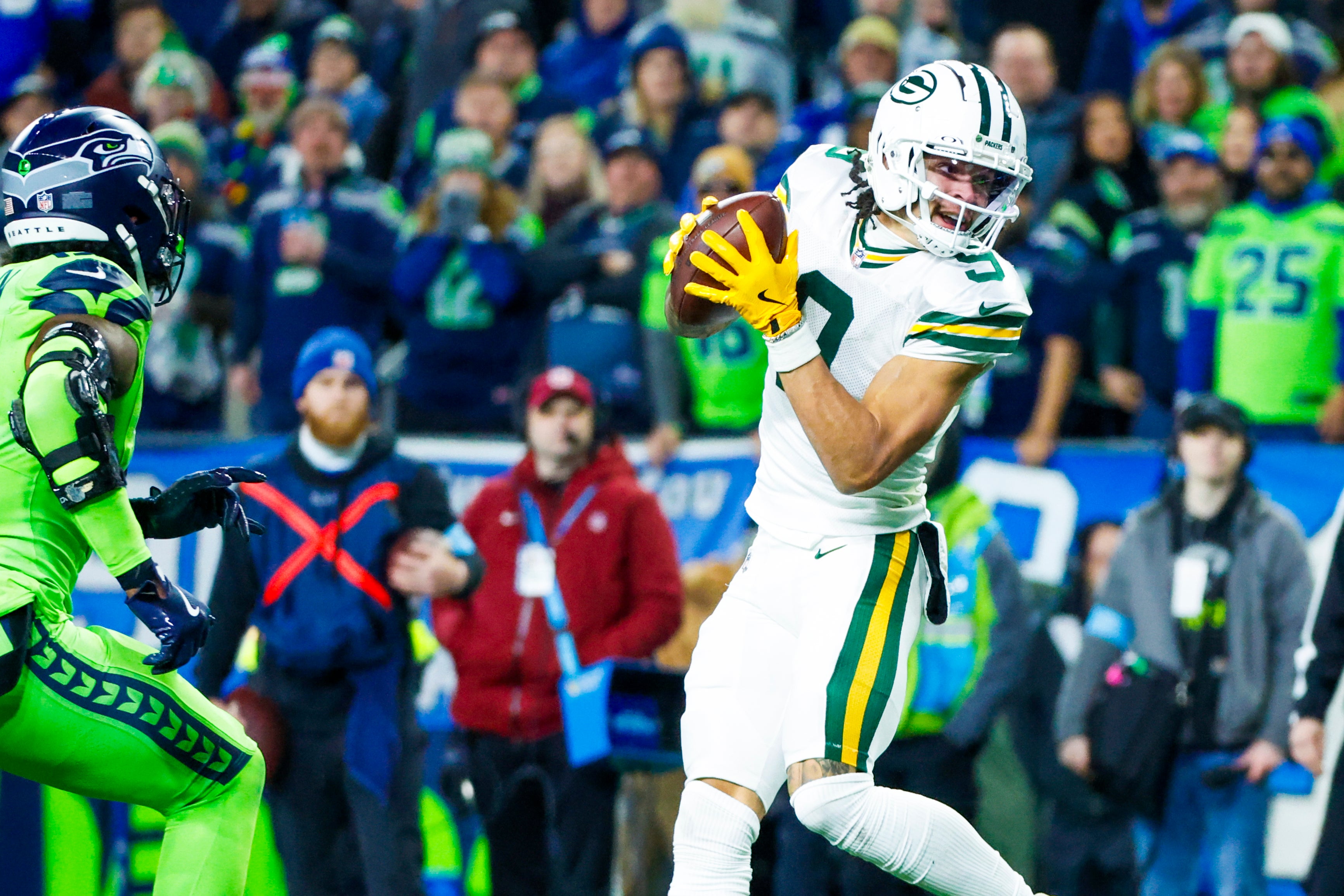 Dec 15, 2024; Seattle, Washington, USA; Green Bay Packers wide receiver Christian Watson (9) catches a pass against the Seattle Seahawks during the third quarter at Lumen Field.
