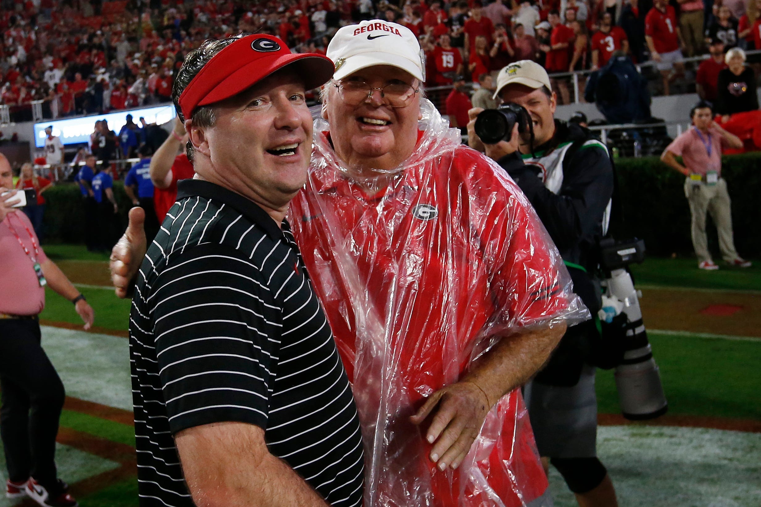 Georgia coach Kirby Smart celebrates with his dad Sonny Smart after a NCAA college football game between Tennessee and Georgia in November.