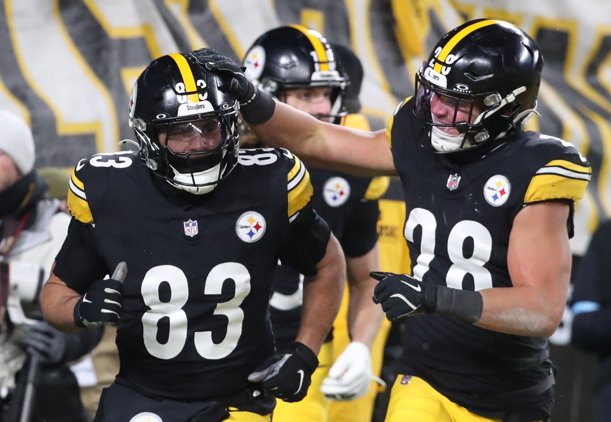 Jan 4, 2025; Pittsburgh, Pennsylvania, USA; Pittsburgh Steelers safety Miles Killebrew (28) congratulates tight end Connor Heyward (83) on his fumble recovery against the Cincinnati Bengals during the fourth quarter at Acrisure Stadium.