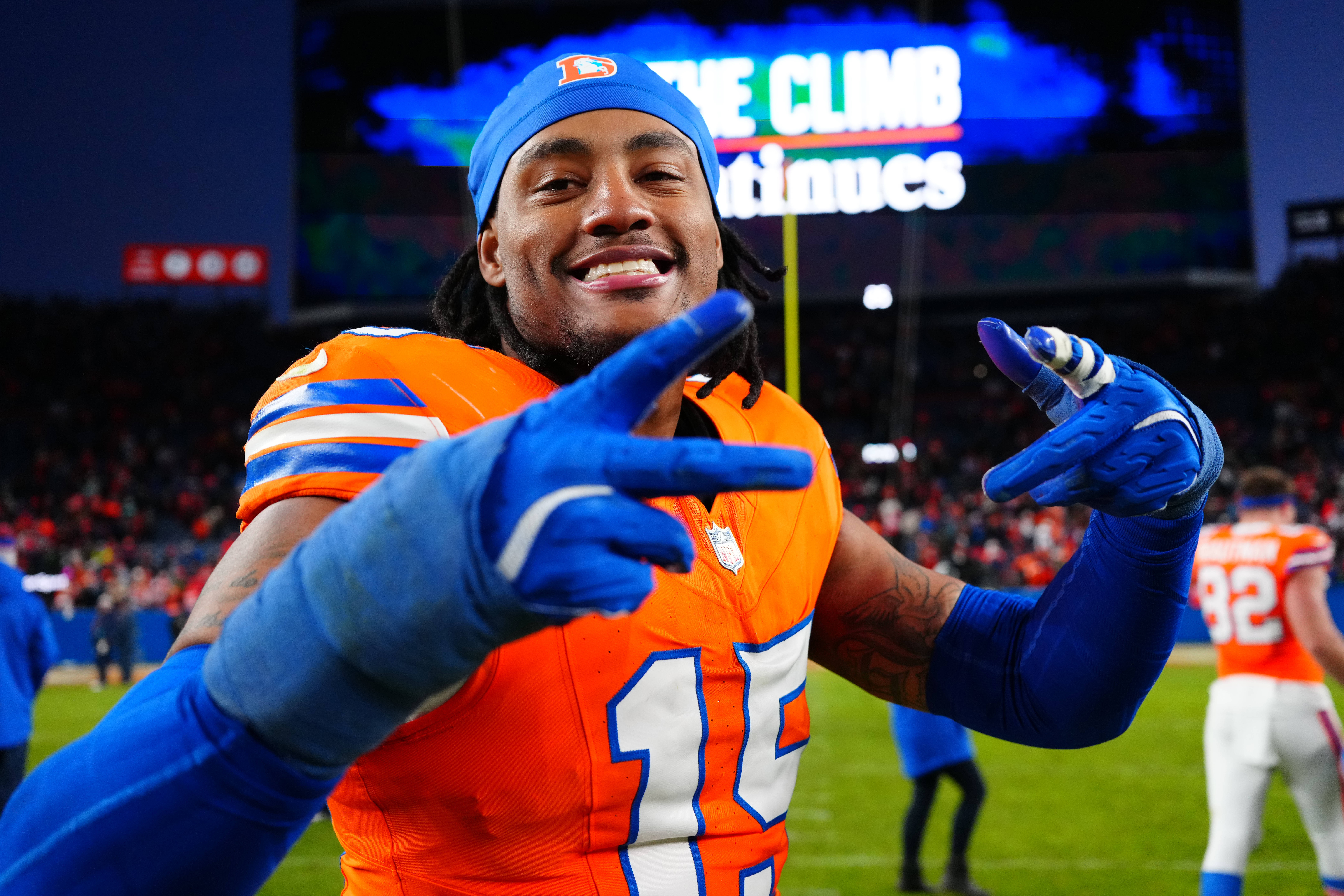 Jan 5, 2025; Denver, Colorado, USA; Denver Broncos linebacker Nik Bonitto (15) following the win against the Kansas City Chiefs at Empower Field at Mile High.