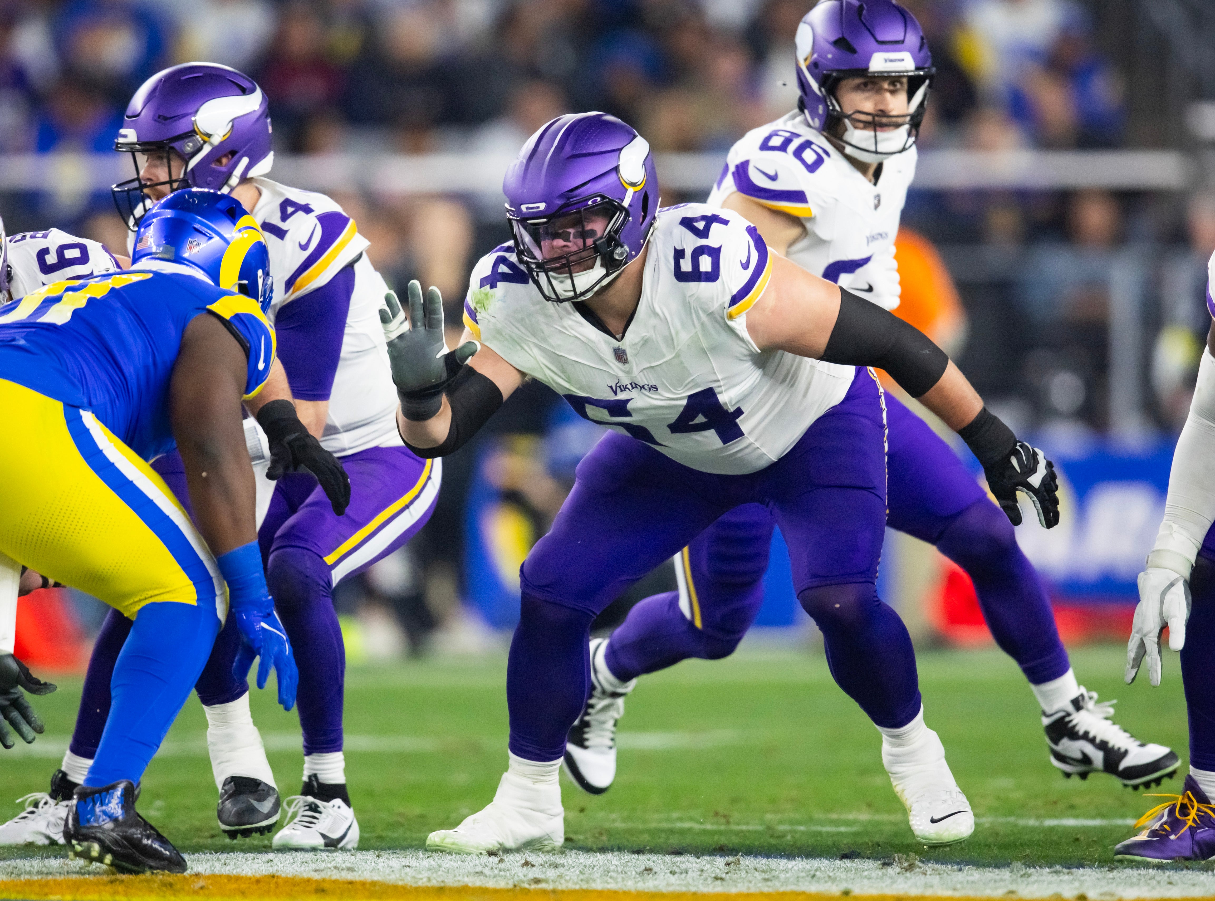 Jan 13, 2025; Glendale, AZ, USA; Minnesota Vikings guard Blake Brandel (64) against the Los Angeles Rams during an NFC wild card game at State Farm Stadium.