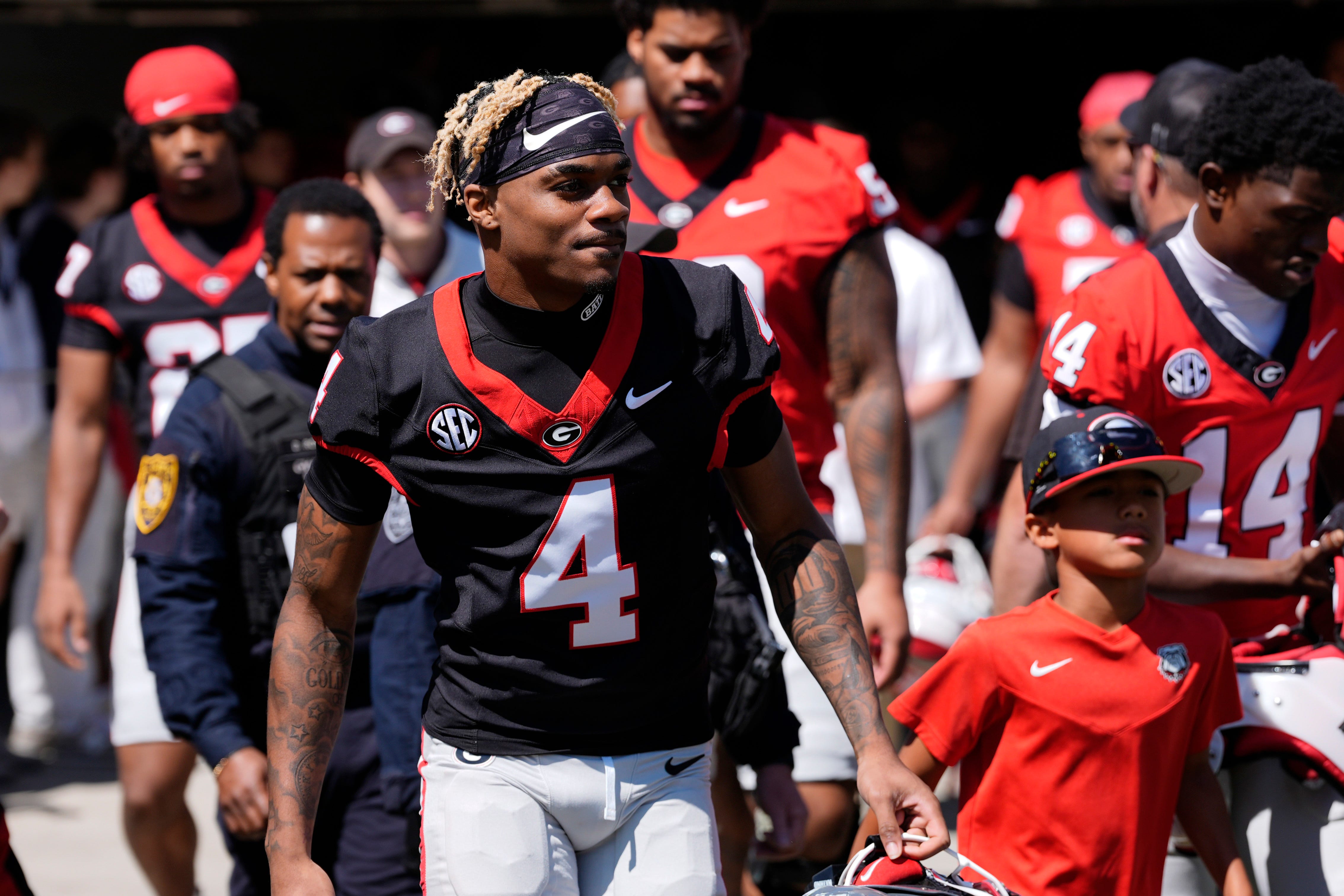 Georgia defensive back KJ Bolden (4) arrives before the start of the Georgia G-Day spring football game in Athens, Ga., on Saturday, April 12, 2025
