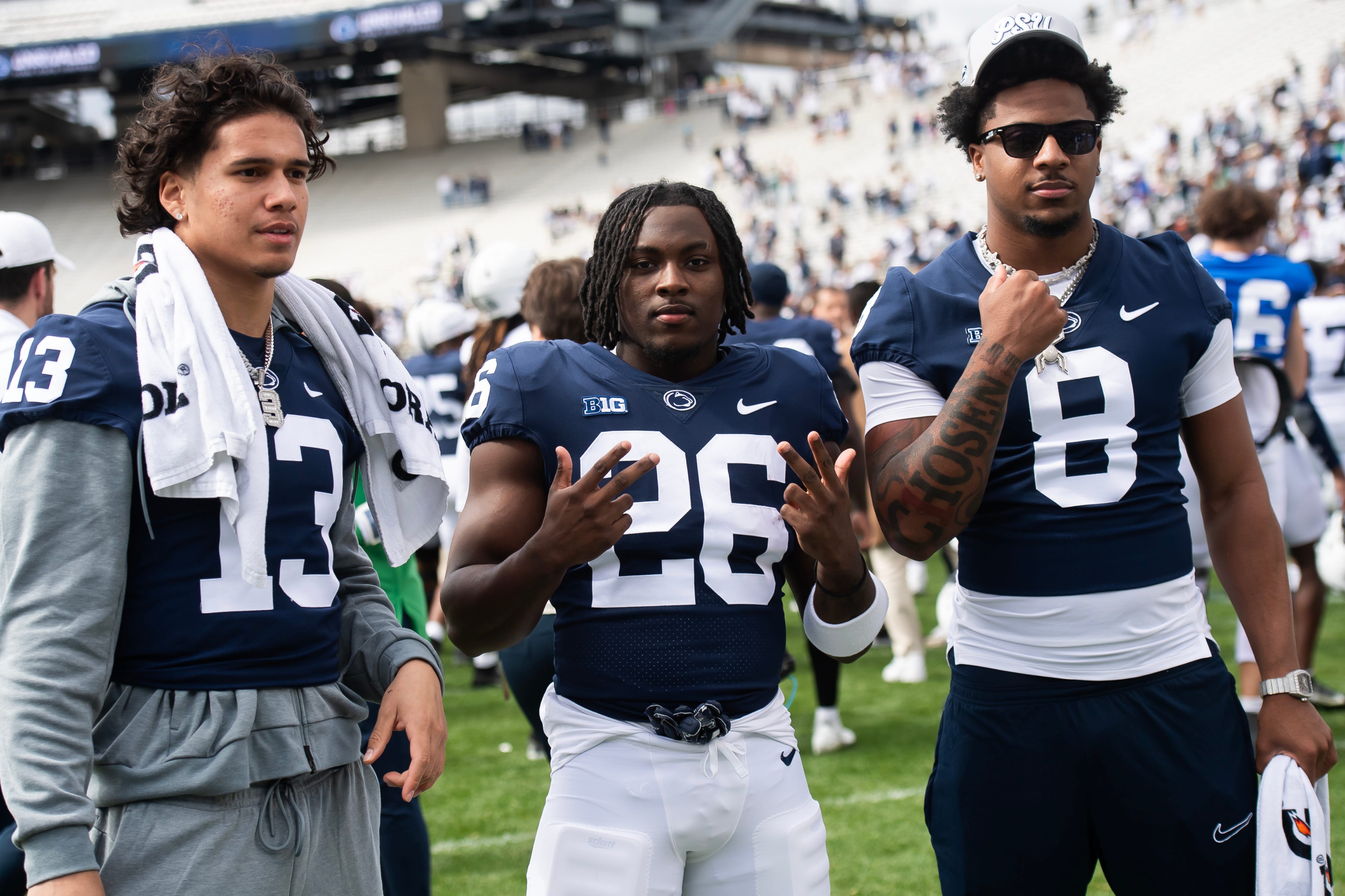 Penn State's Cam Wallace (26) poses for a photo with Tony Rojas (13) and DaKaari Nelson (8) following the Blue-White game at Beaver Stadium on Saturday, April 26, 2025, in State College. The White team defeated the Blue team, 10-8.