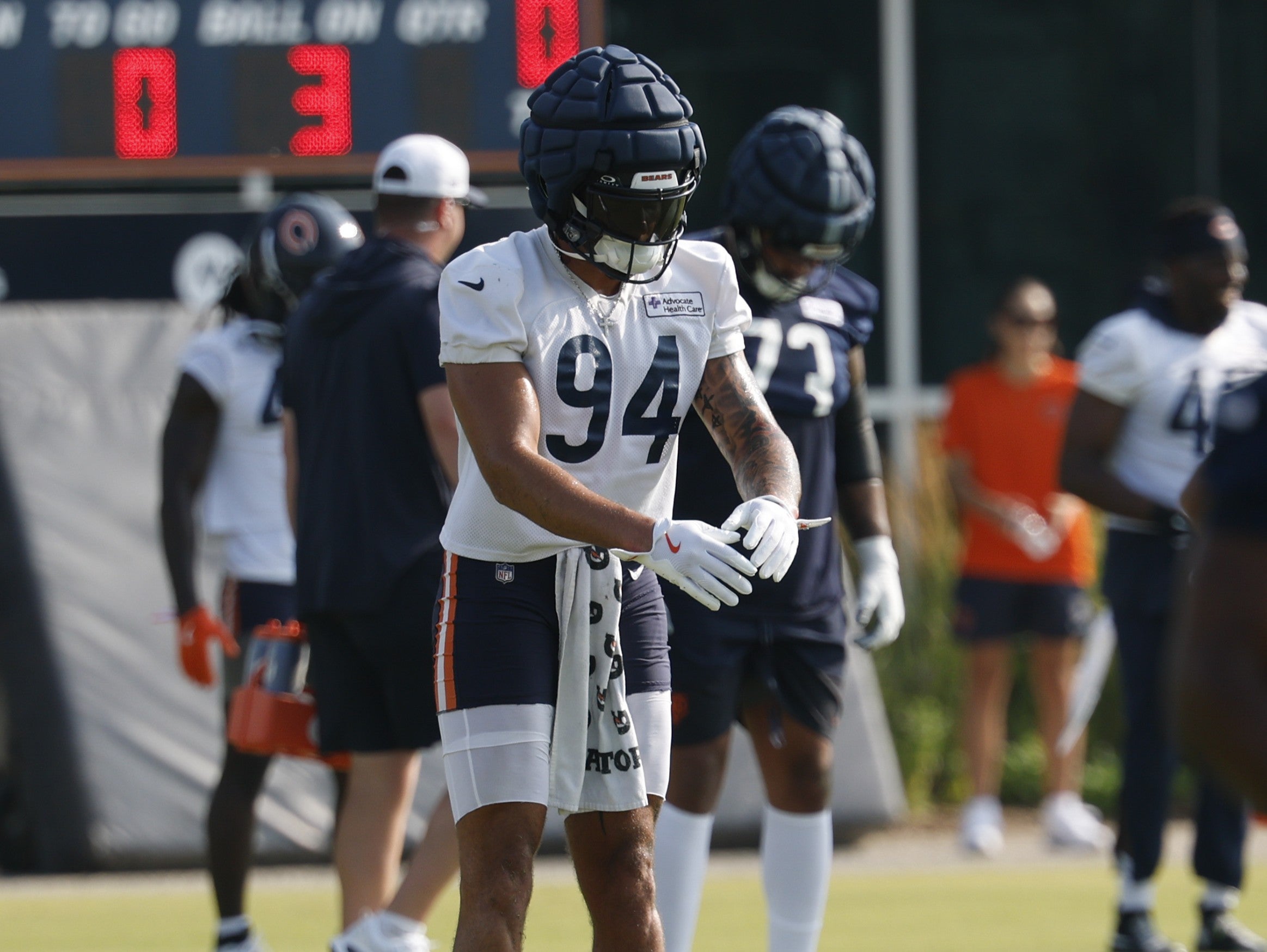 Jul 23, 2025; Lake Forest, IL, USA; Chicago Bears defensive end Austin Booker (94) stretches during training camp at Halas Hall.