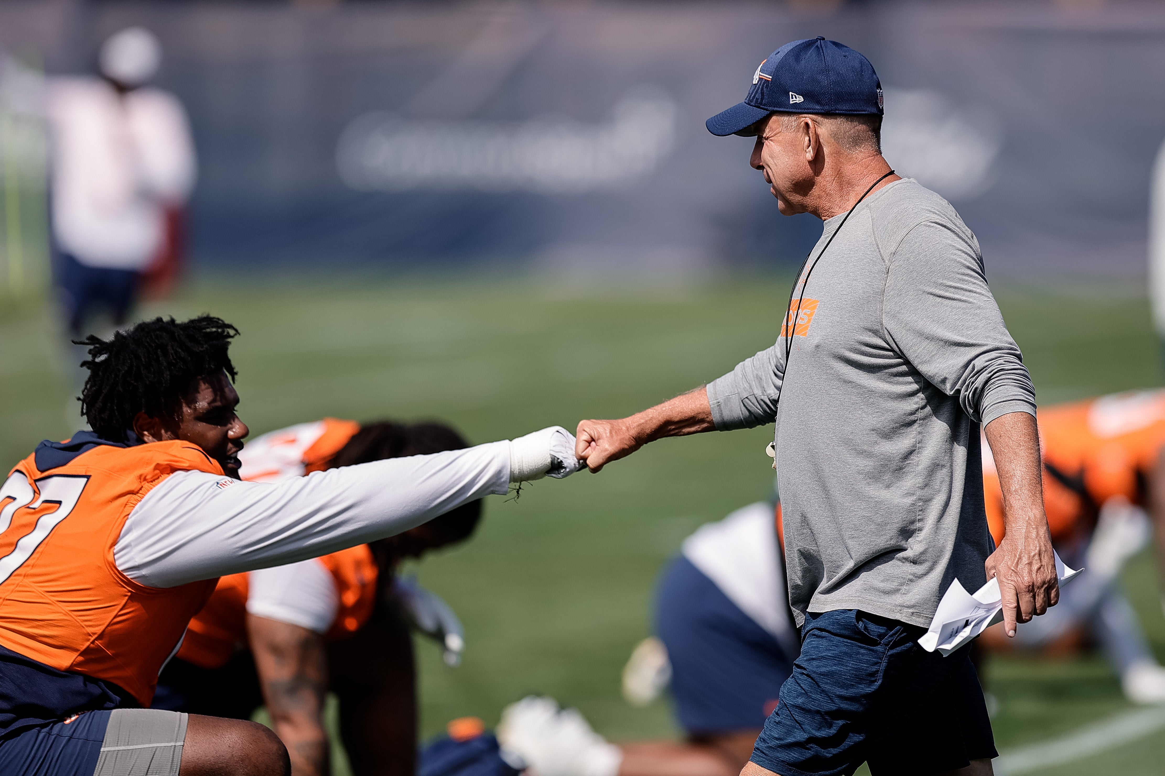 Jul 23, 2025; Englewood, CO, USA; Denver Broncos head coach Sean Payton and defensive tackle Malcolm Roach (97) during Denver Broncos Training Camp.