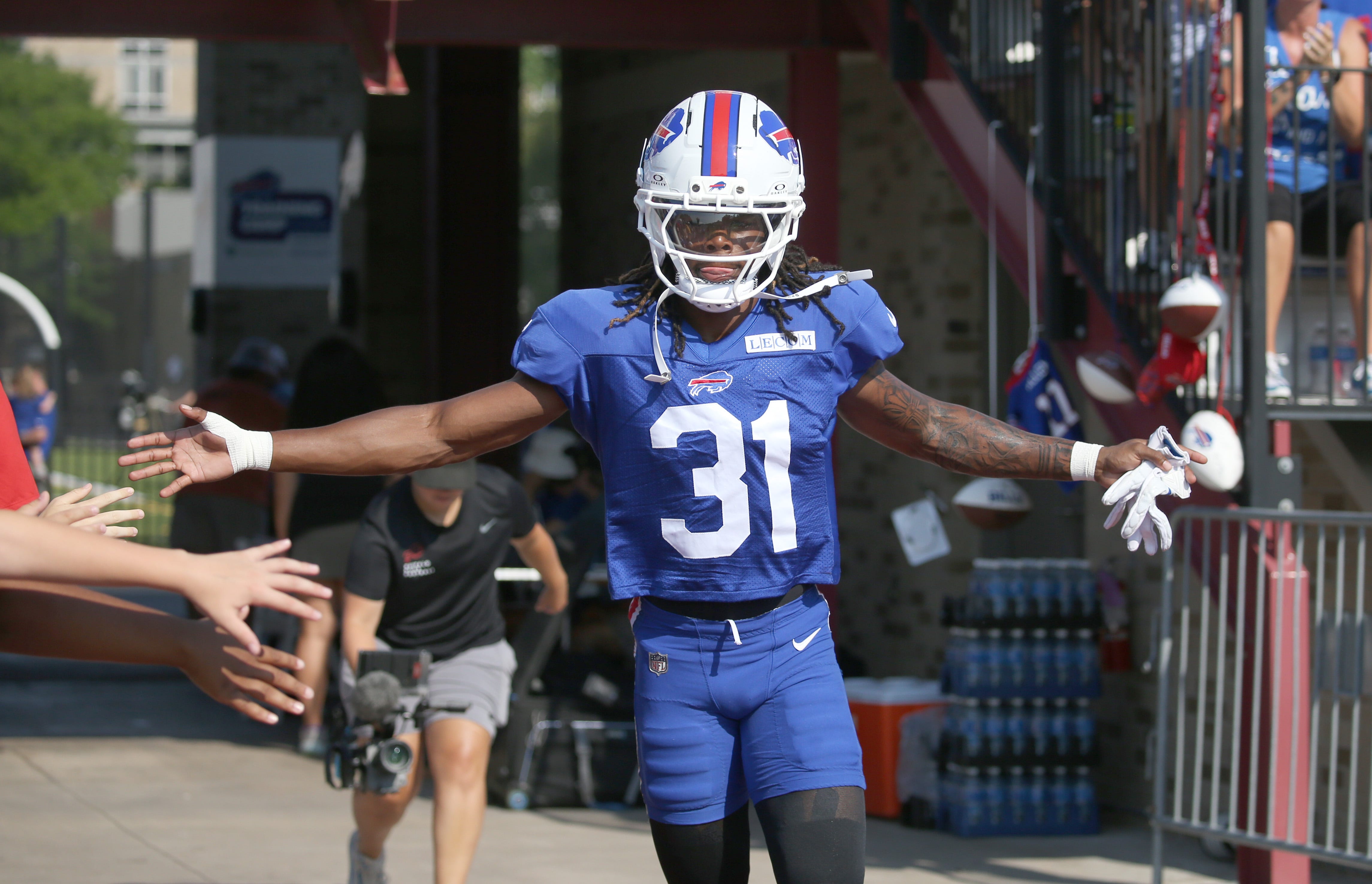 Bills rookie defensive back Maxwell Hairston high-fives fans as he runs onto the field during day five of Buffalo Bills training camp at St. John Fisher University Monday, July 28, 2025 in Pittsford, NY.