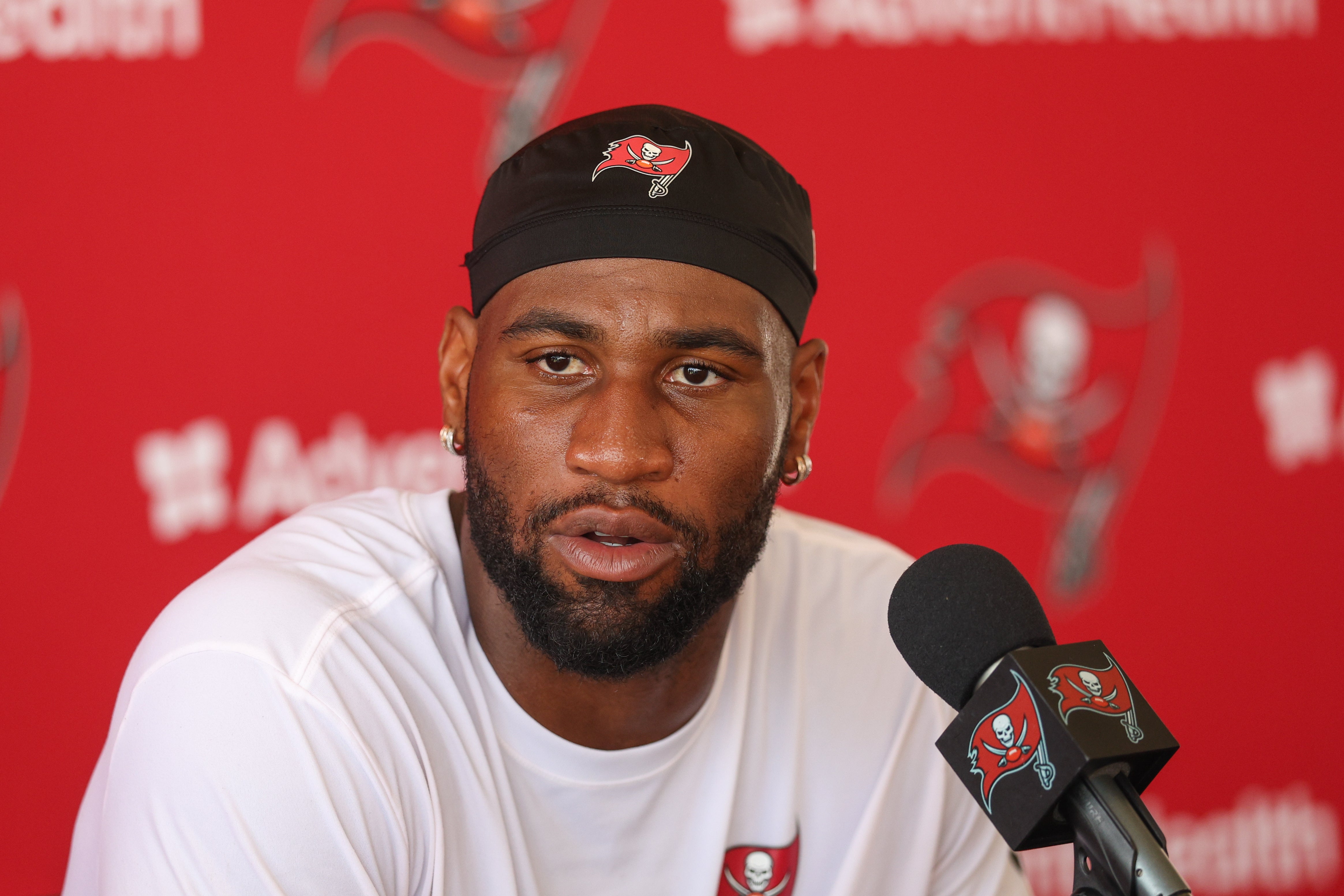 Aug 1, 2025; Tampa, FL, USA; Tampa Bay Buccaneers linebacker Haason Reddick (5) talks to media after training camp at AdventHealth Training Center.