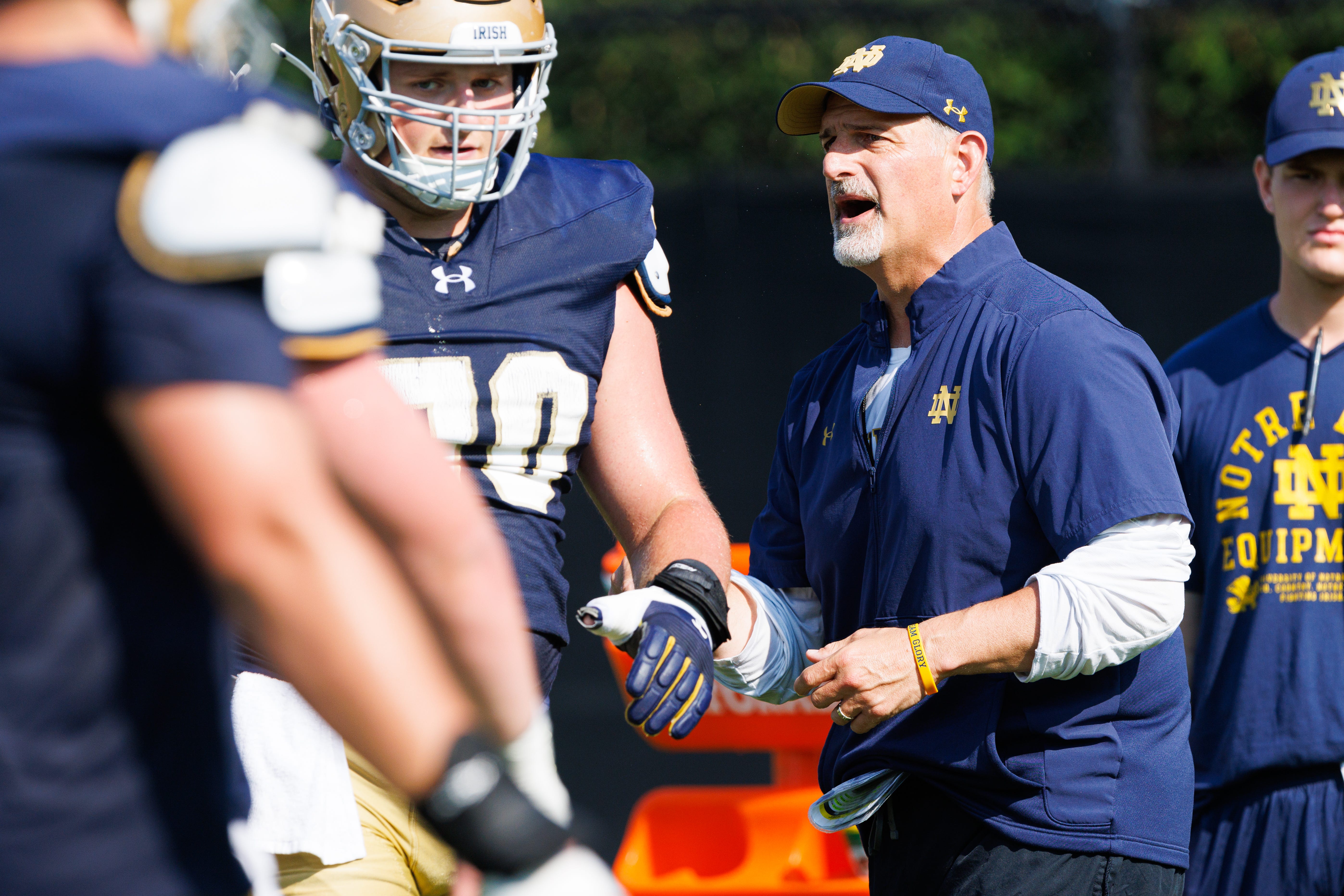 Notre Dame offensive line coach Joe Rudolph leads a drill during a football practice at Irish Athletic Center on Wednesday, Aug. 6, 2025, in South Bend.