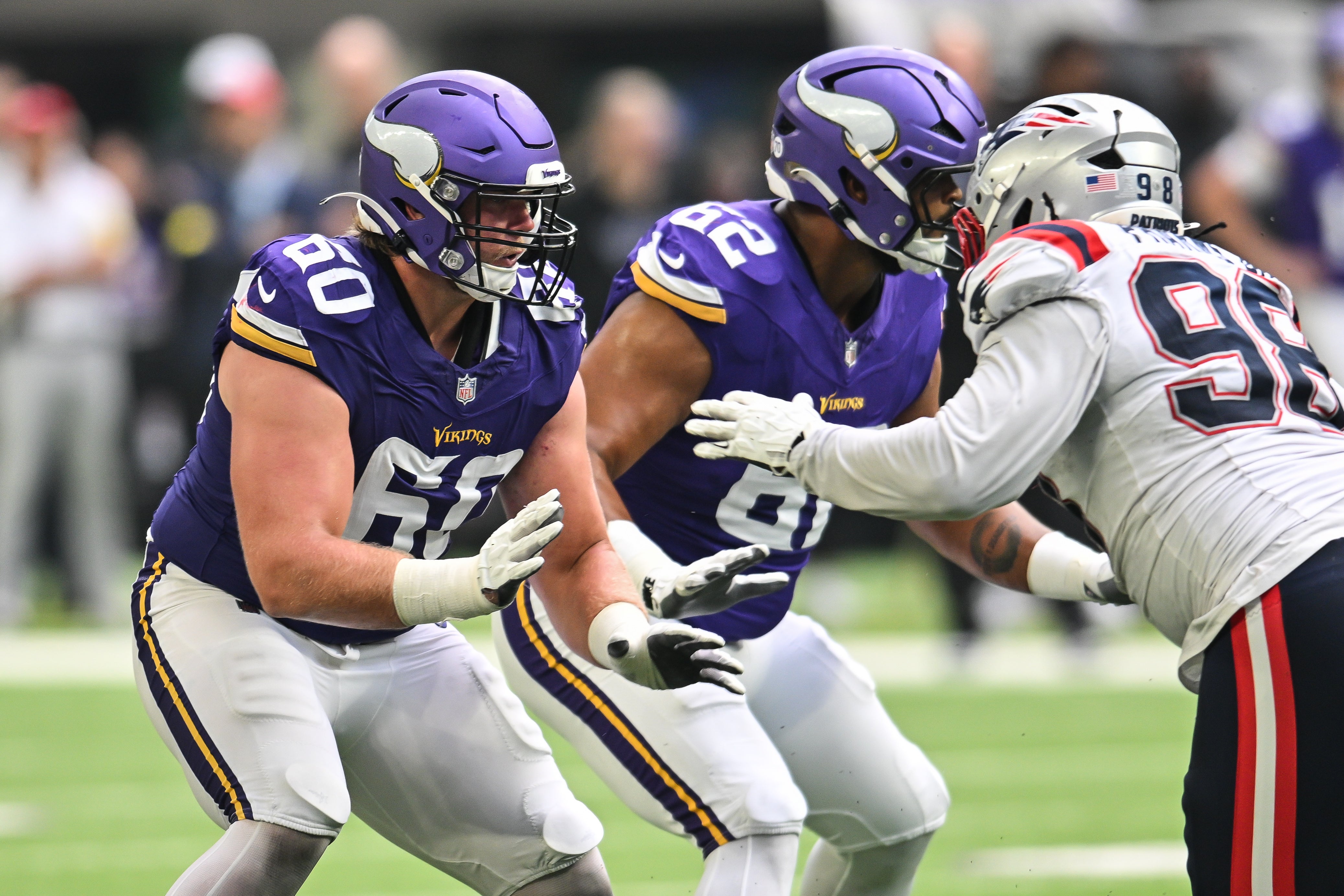 Aug 16, 2025; Minneapolis, Minnesota, USA; Minnesota Vikings guard Joe Huber (60) goes to block New England Patriots defensive tackle Jeremiah Pharms Jr. (98) during the fourth quarter at U.S. Bank Stadium.