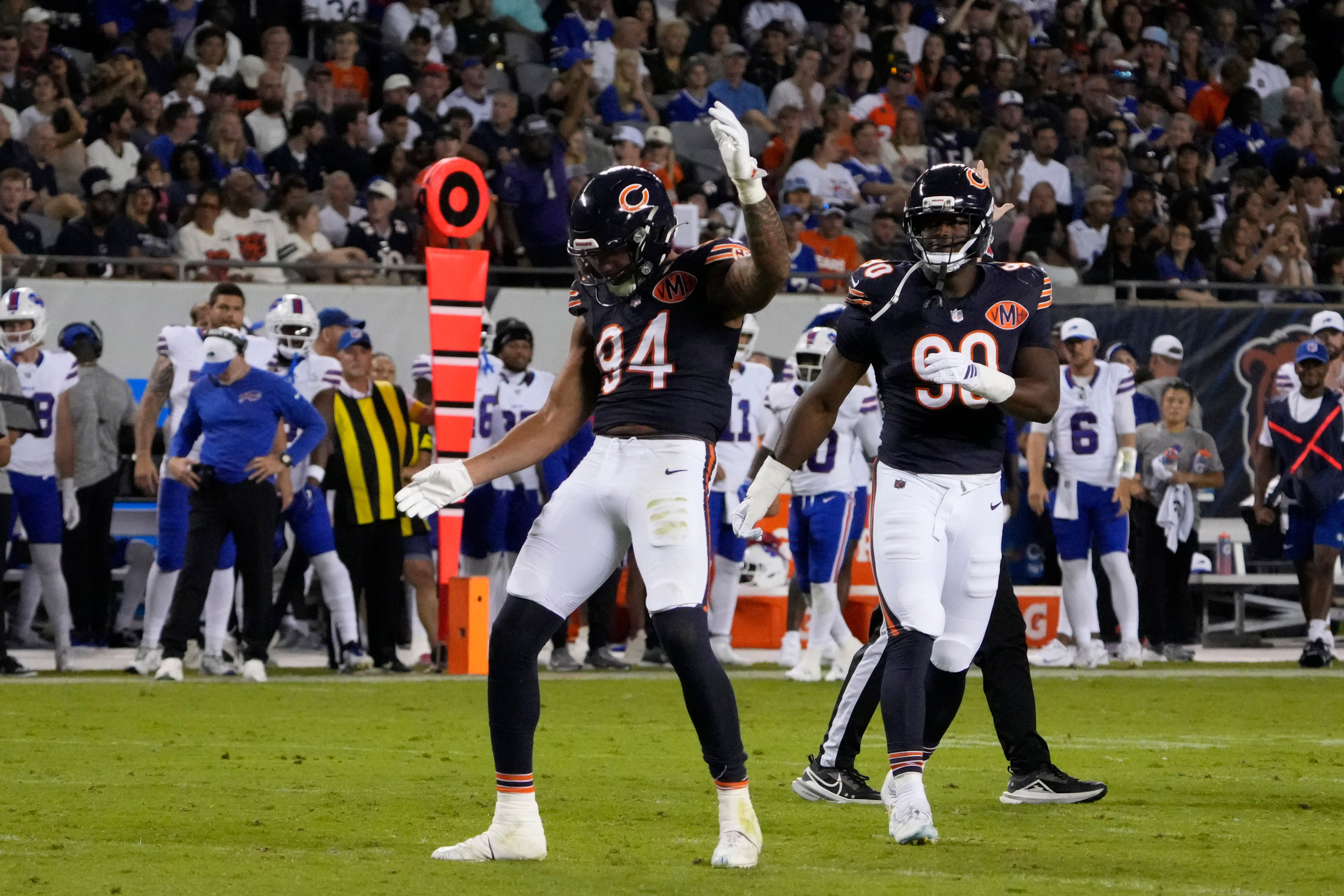 Aug 17, 2025; Chicago, Illinois, USA; Chicago Bears defensive end Austin Booker (94) celebrates after sacking Buffalo Bills quarterback Mike White (14) during the first half at Soldier Field.